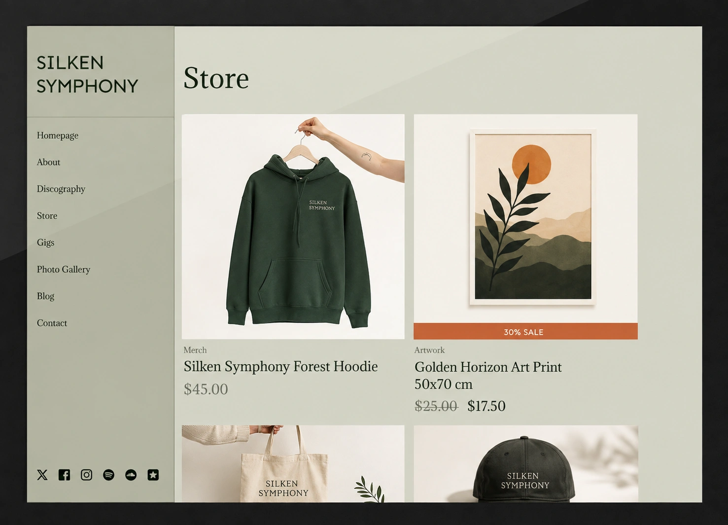 Merch store page on a musician website open on a laptop