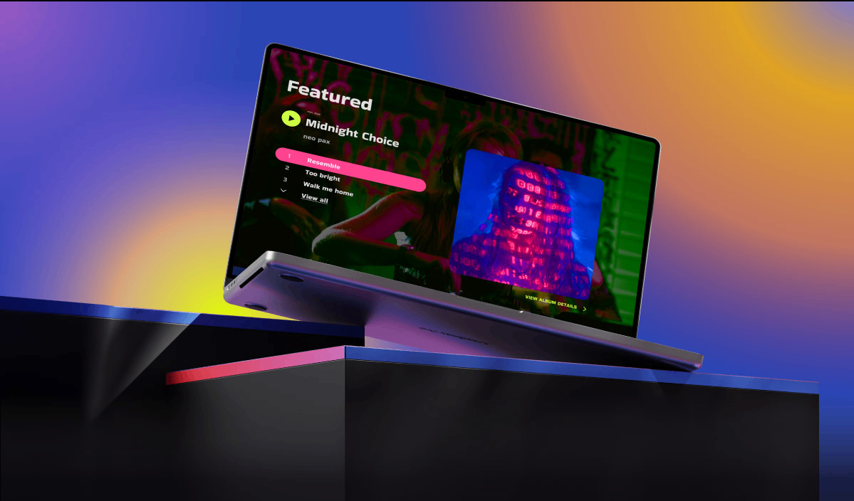 How to Build a Website as a Singer or Songwriter (and Get Heard): a laptop is sitting on a table with a colorful background