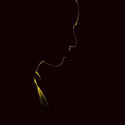 a silhouette of a person in a dark background