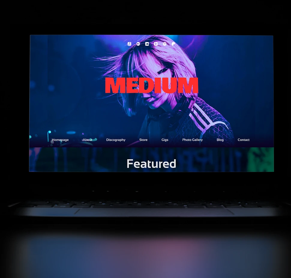 Noiseyard website builder for musicians, banner: Noiseyard music website builder shown on laptop