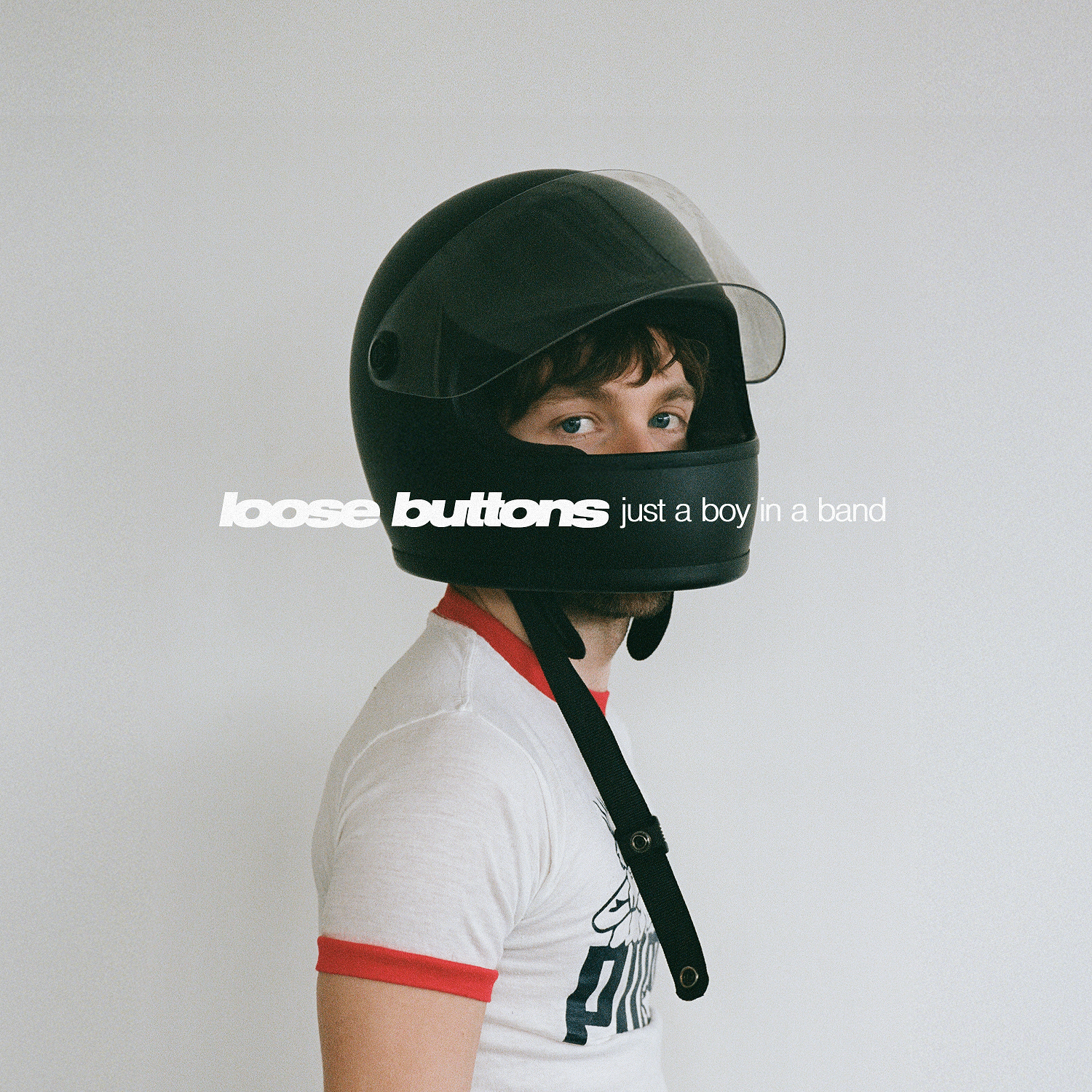Loose Buttons - Just A Boy In A Band: a man wearing a motorcycle helmet