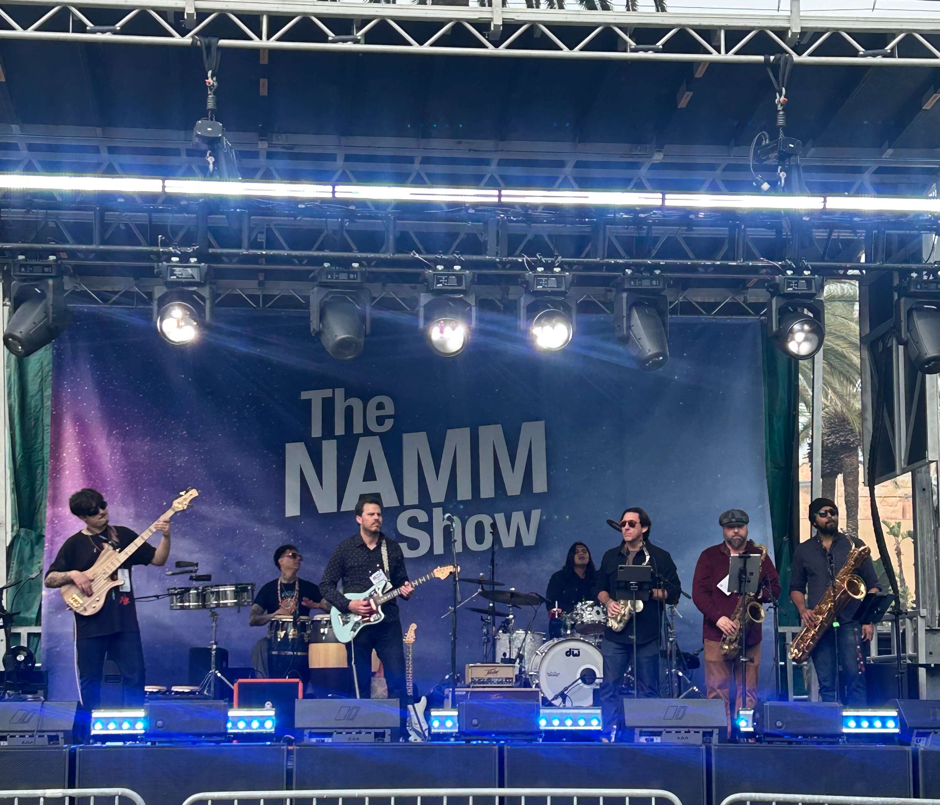 the namm show on stage with a band on stage