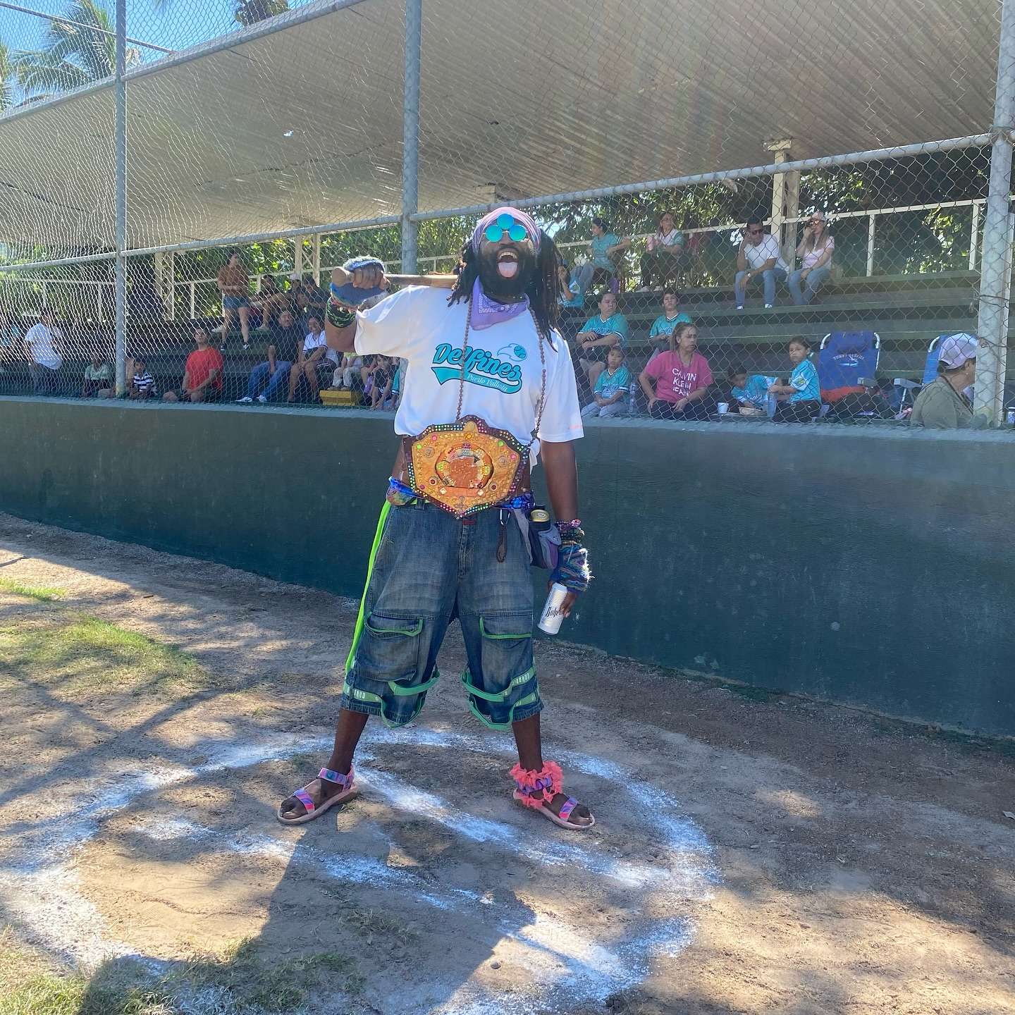 30) between the lines: a man standing on a baseball field with a belt