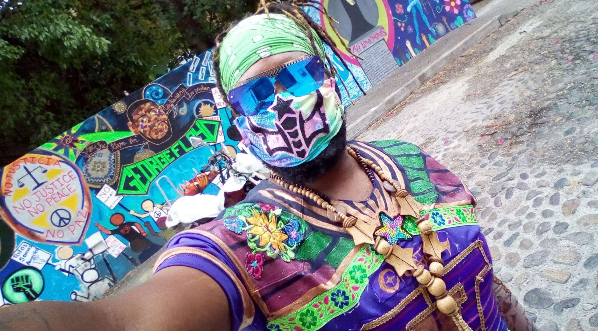 33) WHERE'S MY SUPERSUIT: a man with a colorful face is taking a picture