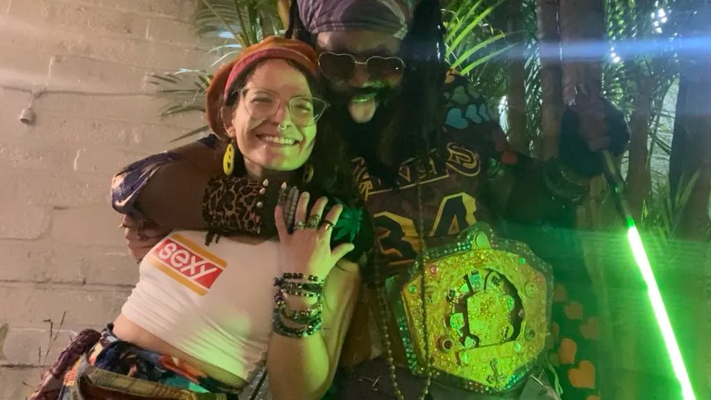 42) "we share the night": a man and a woman posing for a photo