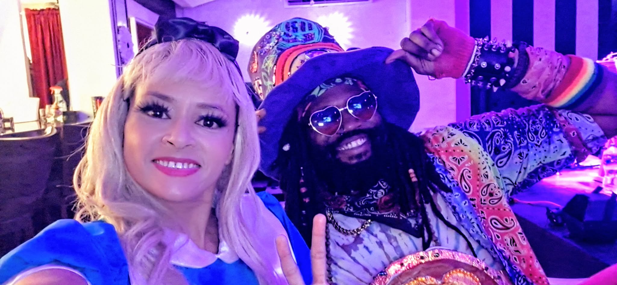 a man and a woman posing for a photo at a party