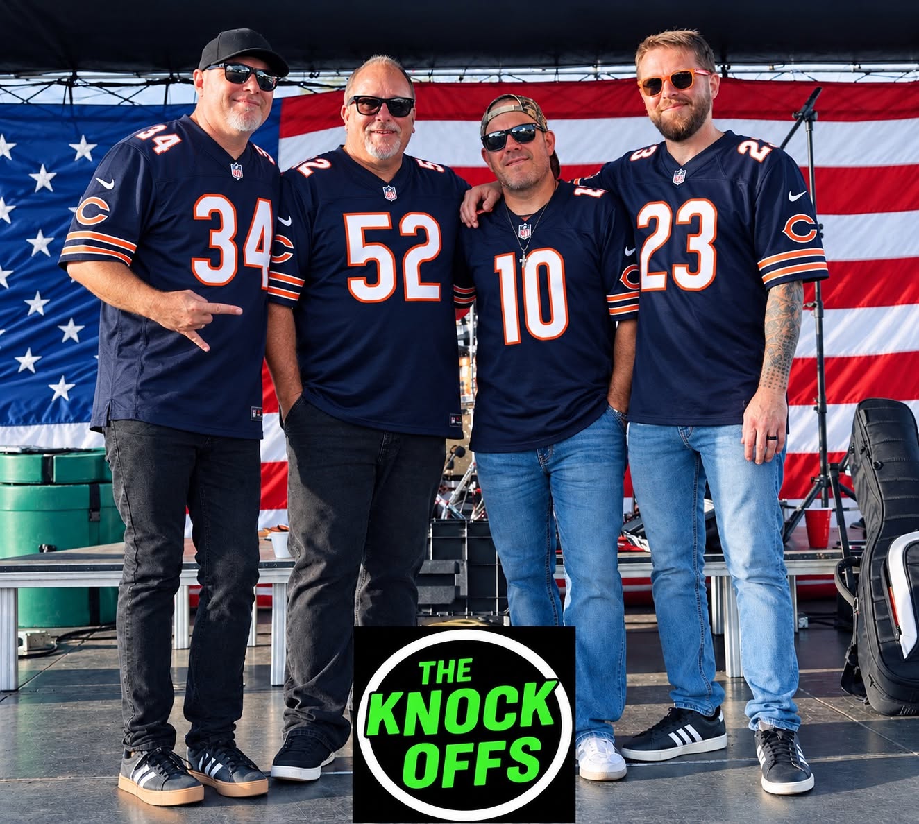 a group of chicago bears posing in front of an american flag