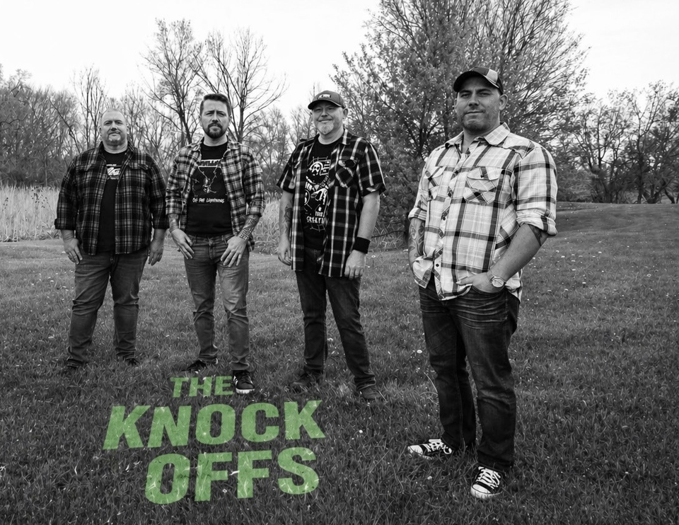 the knock offs are standing in front of a grassy field