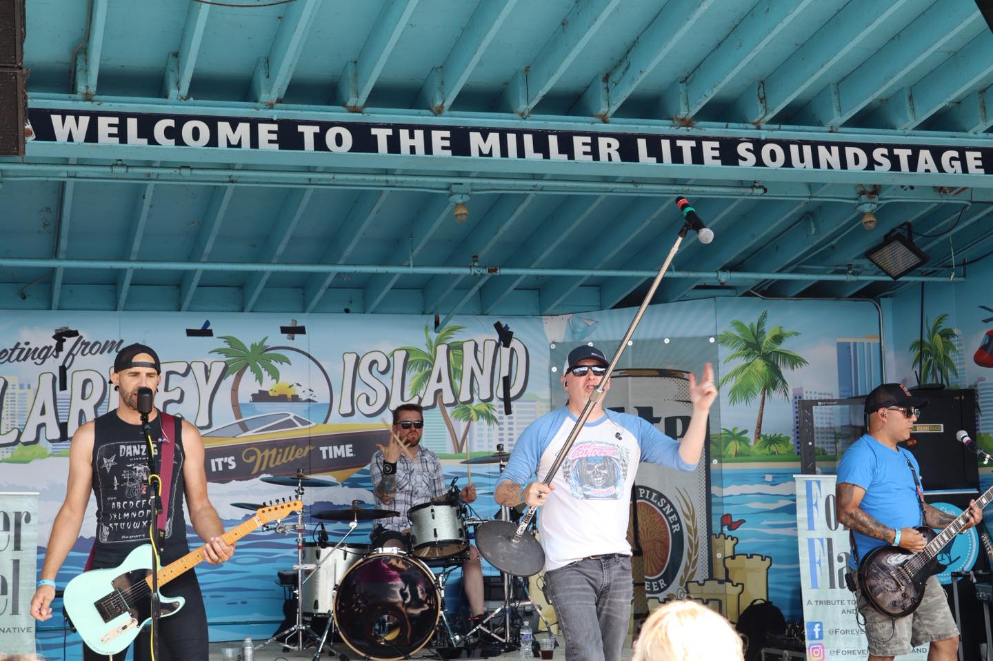a group of people on stage at the miller life stage