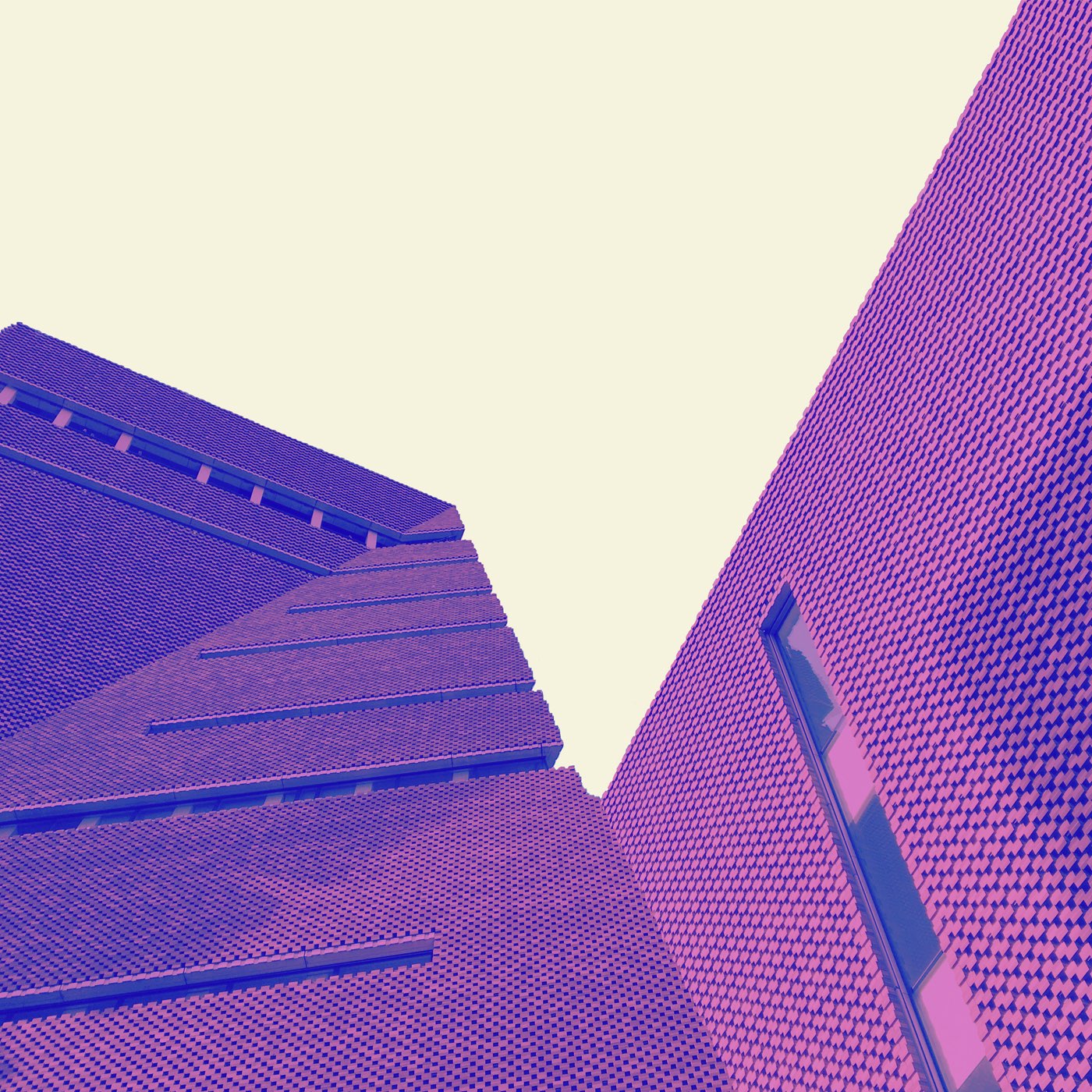 a purple and purple building with a blue sky