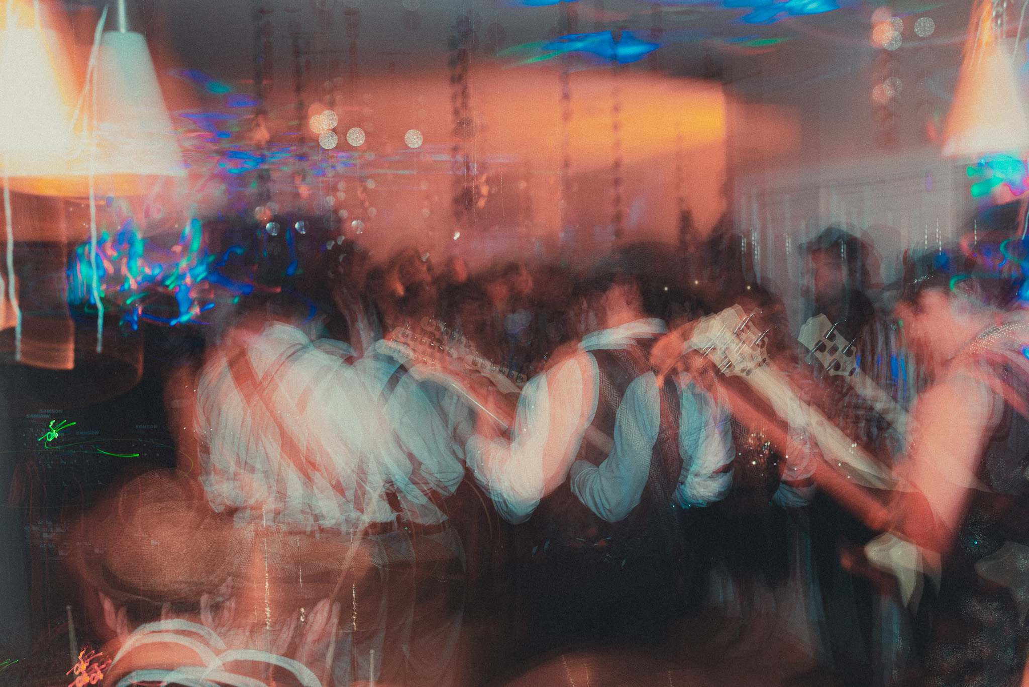 a blurry picture of a group of people at a party