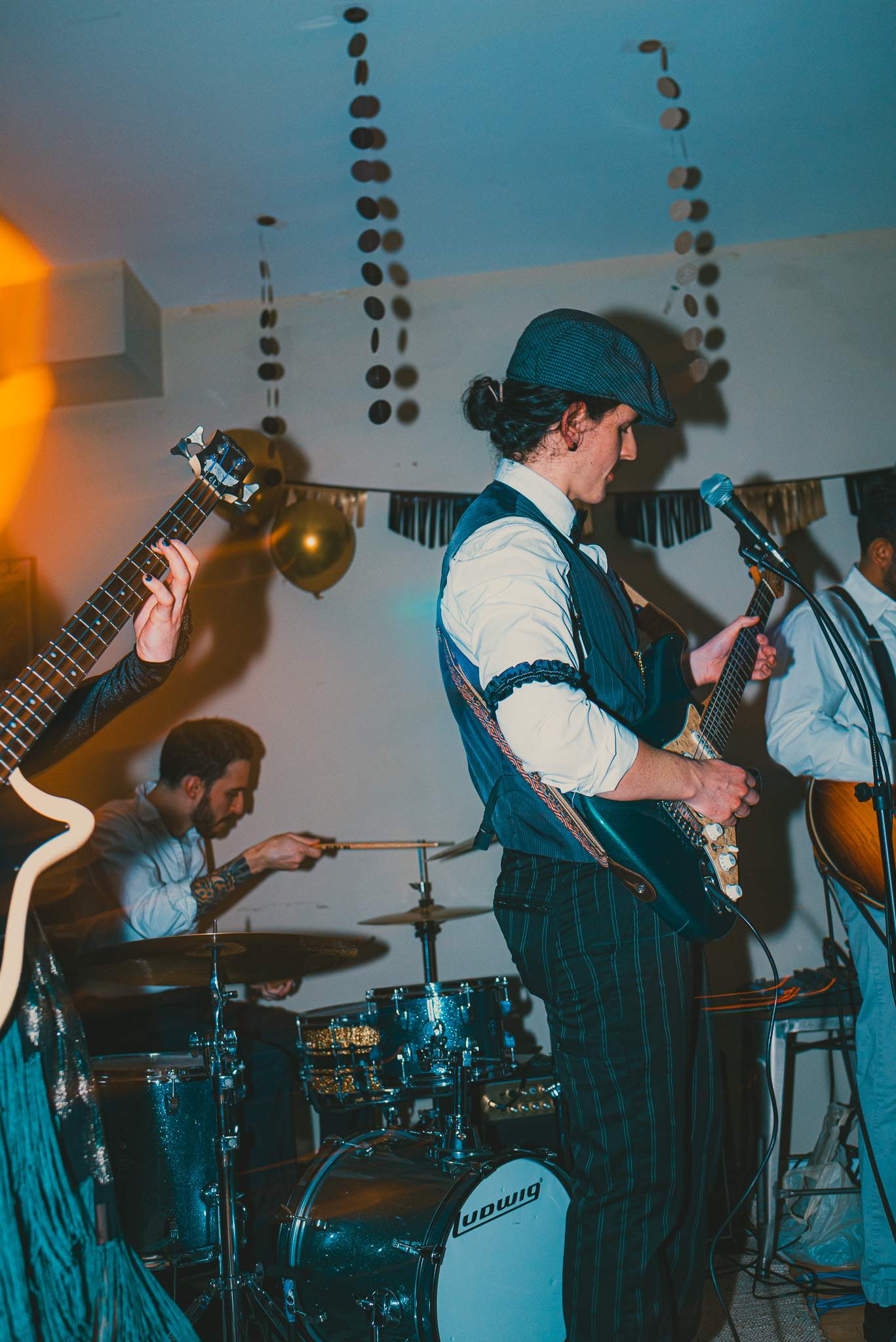 a group of people playing guitars in a room