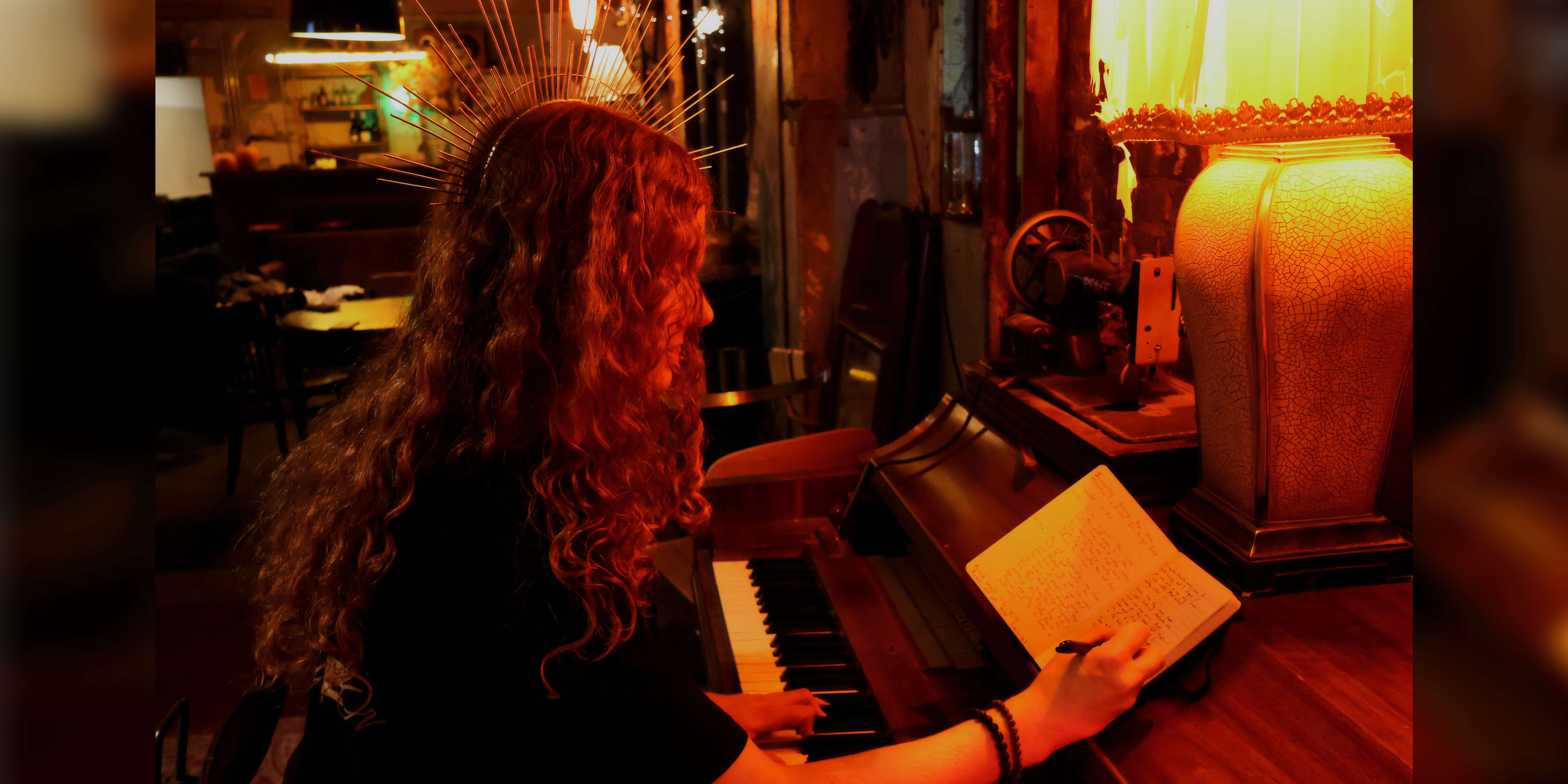 a woman sitting at a piano