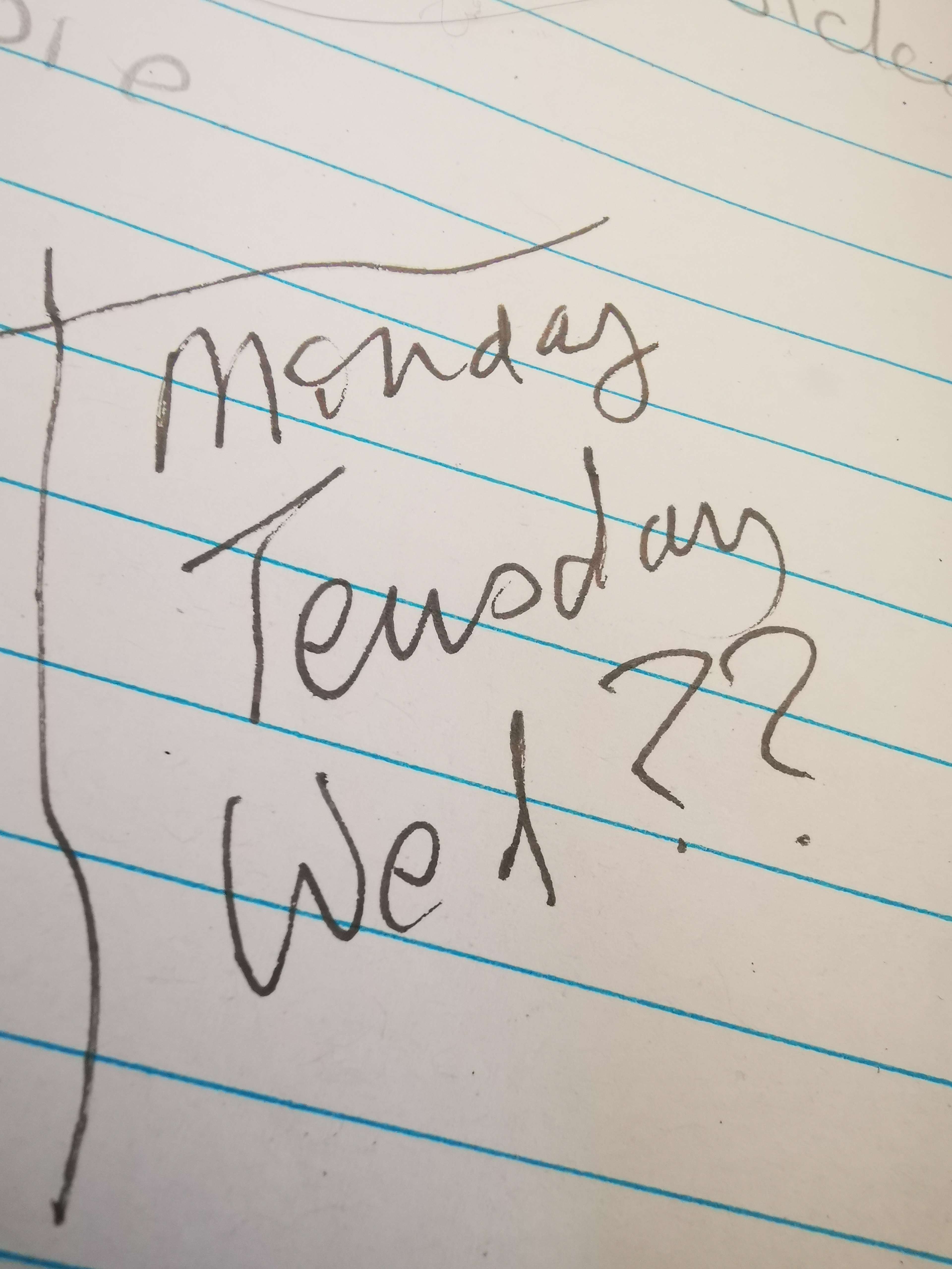 a notebook with the words monday tuesday wed