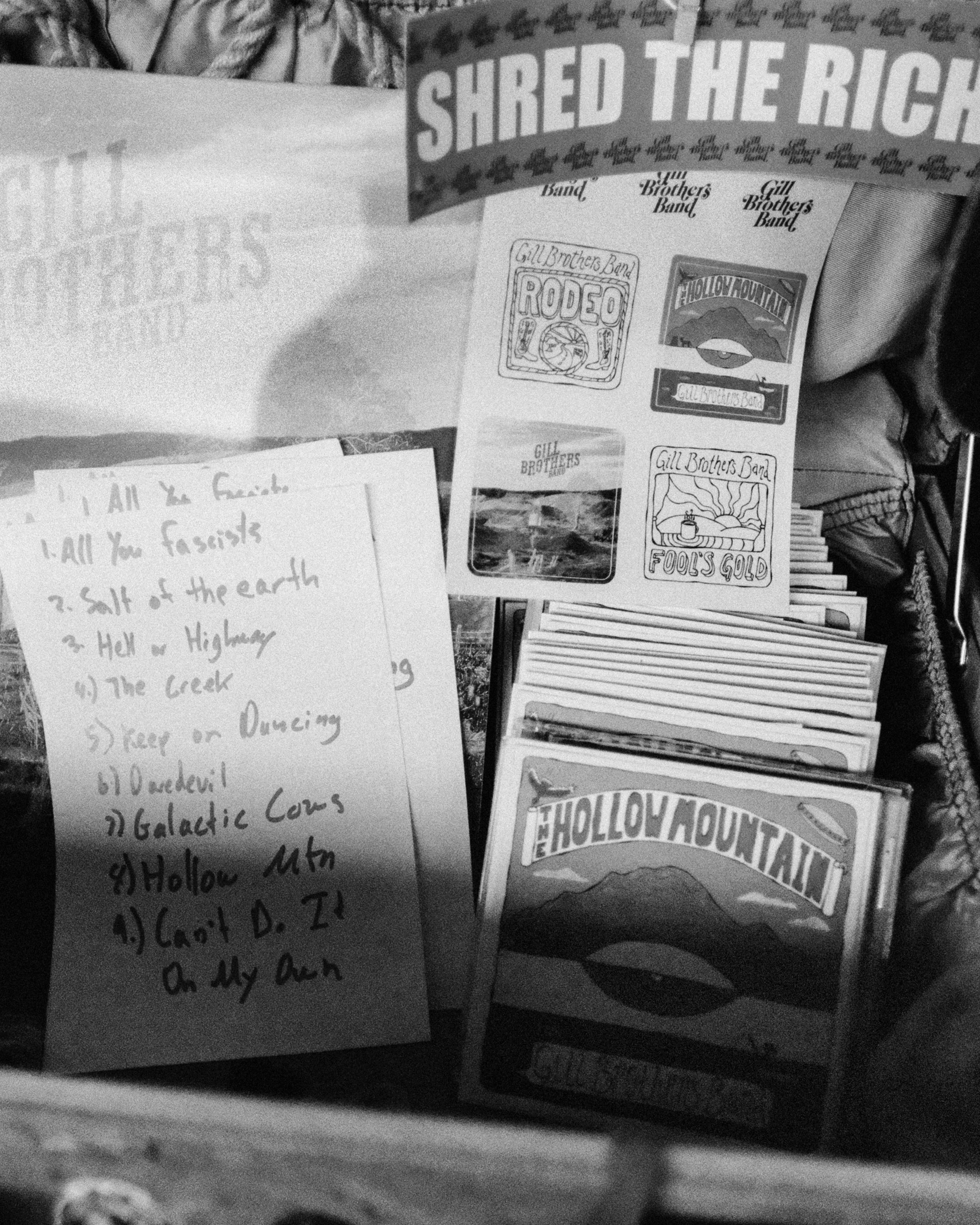 a black and white photo of a suitcase filled with various items