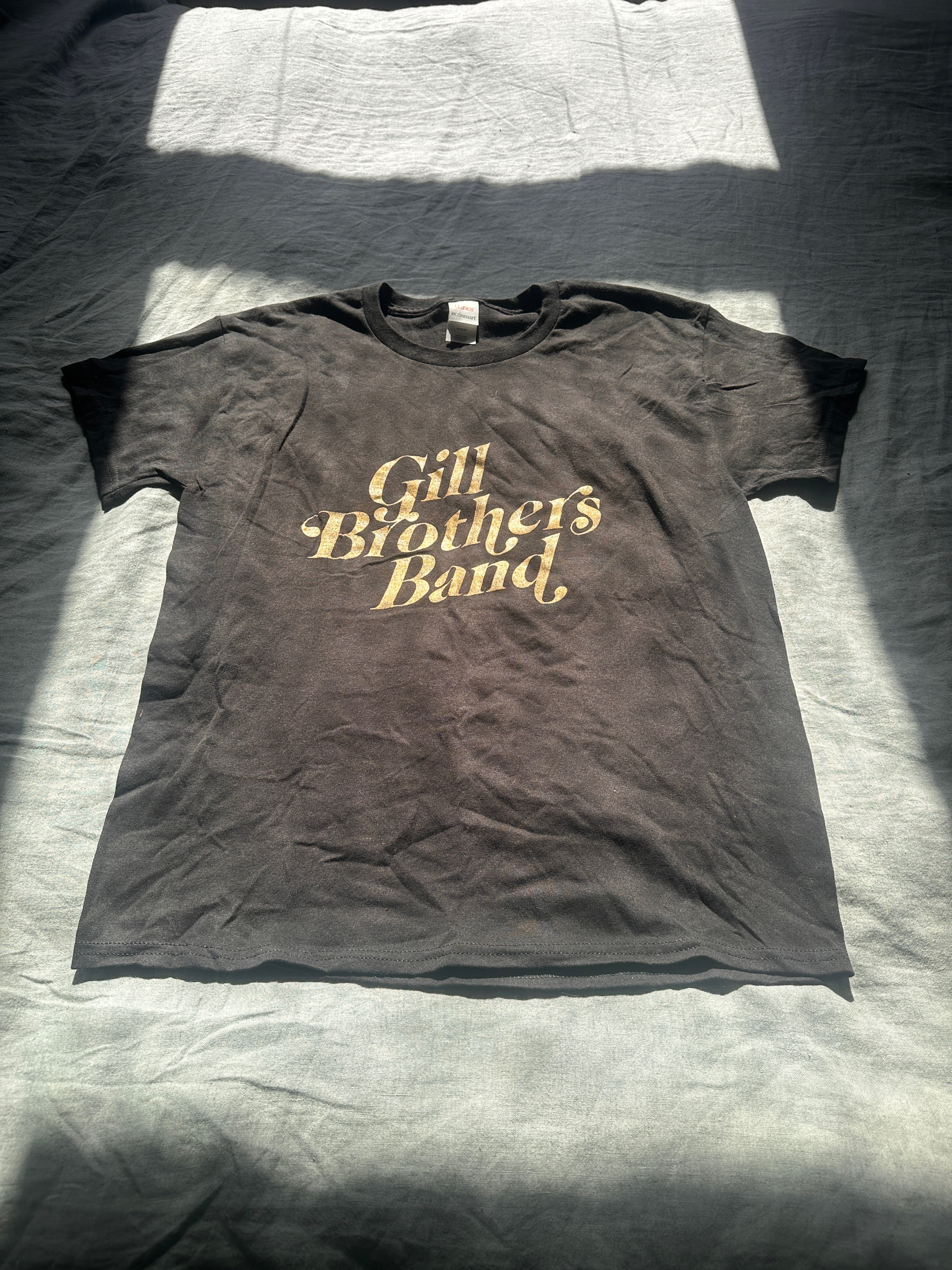 a black t - shirt with the words gilbert brothers band on it