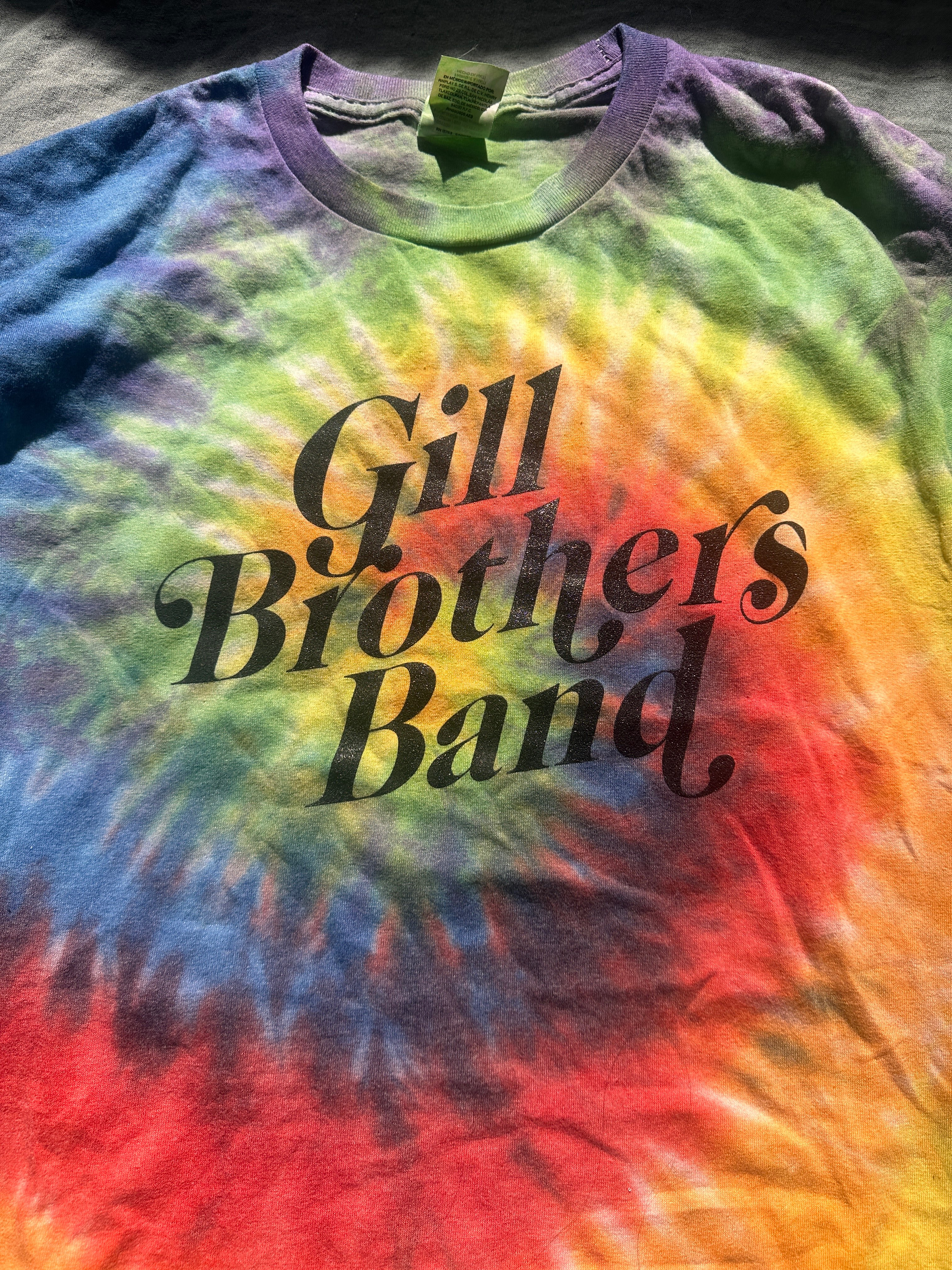 a tie dye t - shirt that says gill brothers band