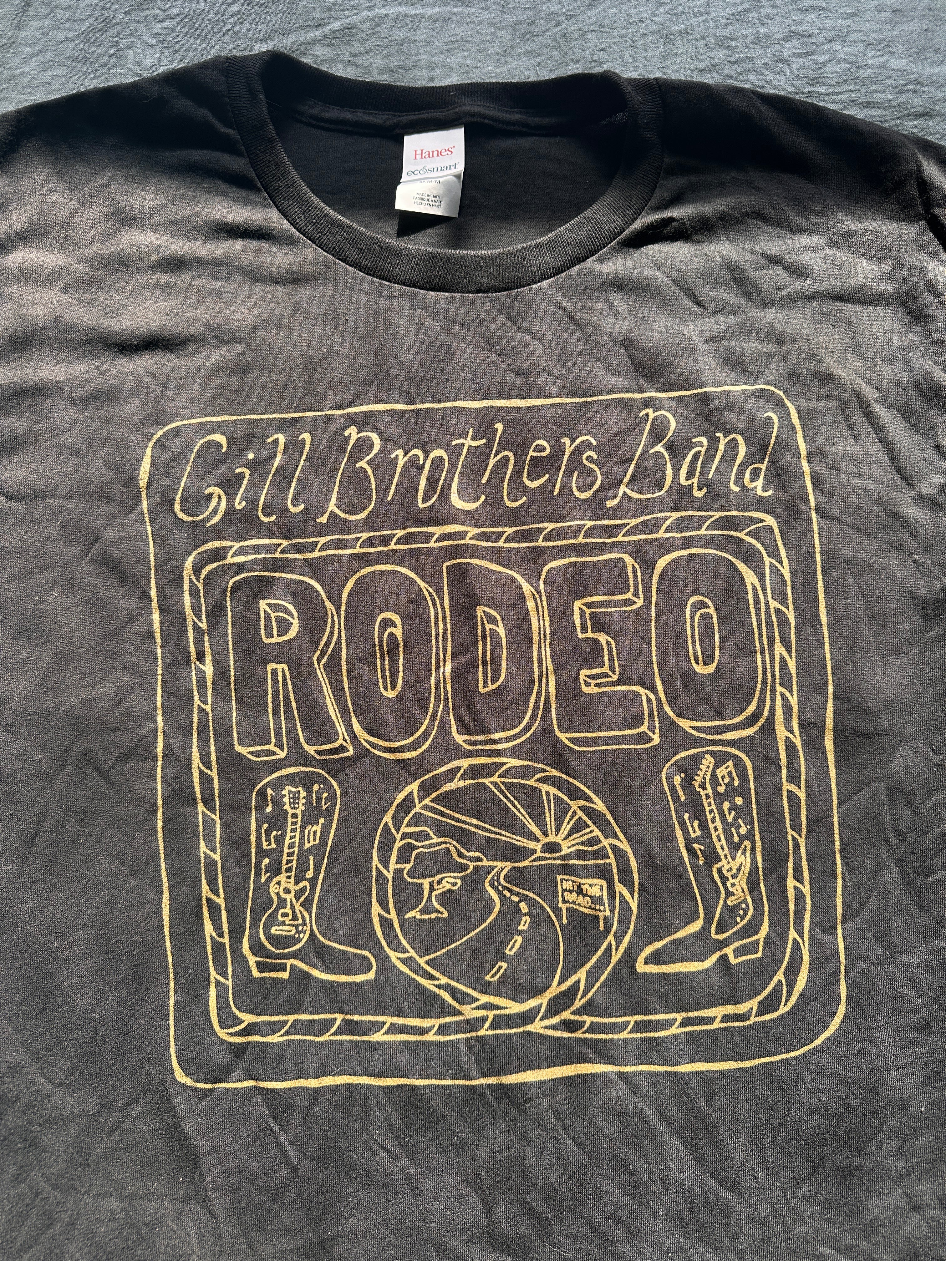 a black t - shirt that says gil brothers rodeo