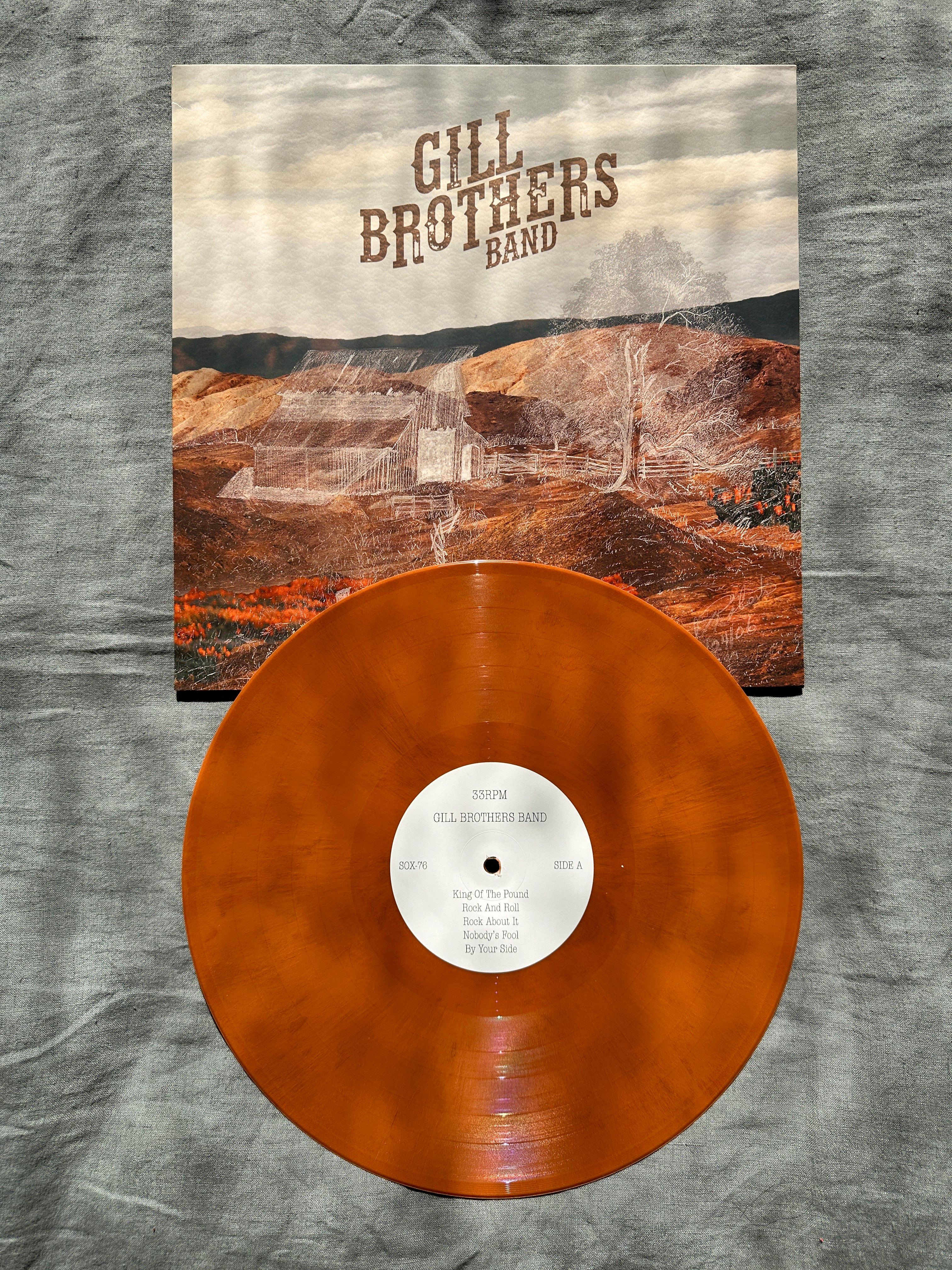 an orange lp with the words gill brothers band on it