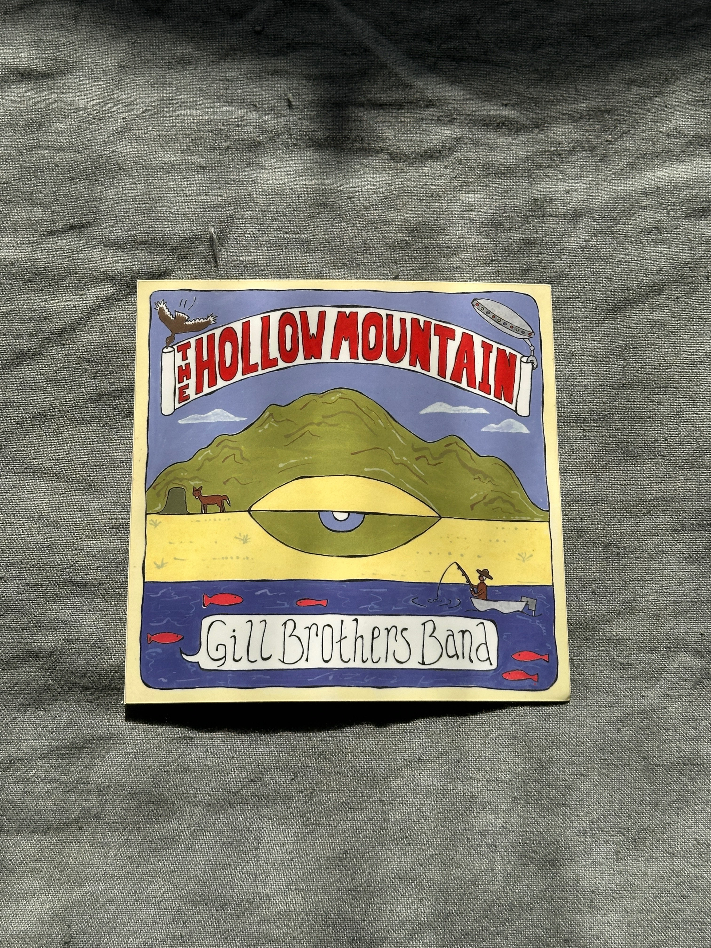 a sticker with the words hollow mountain on it