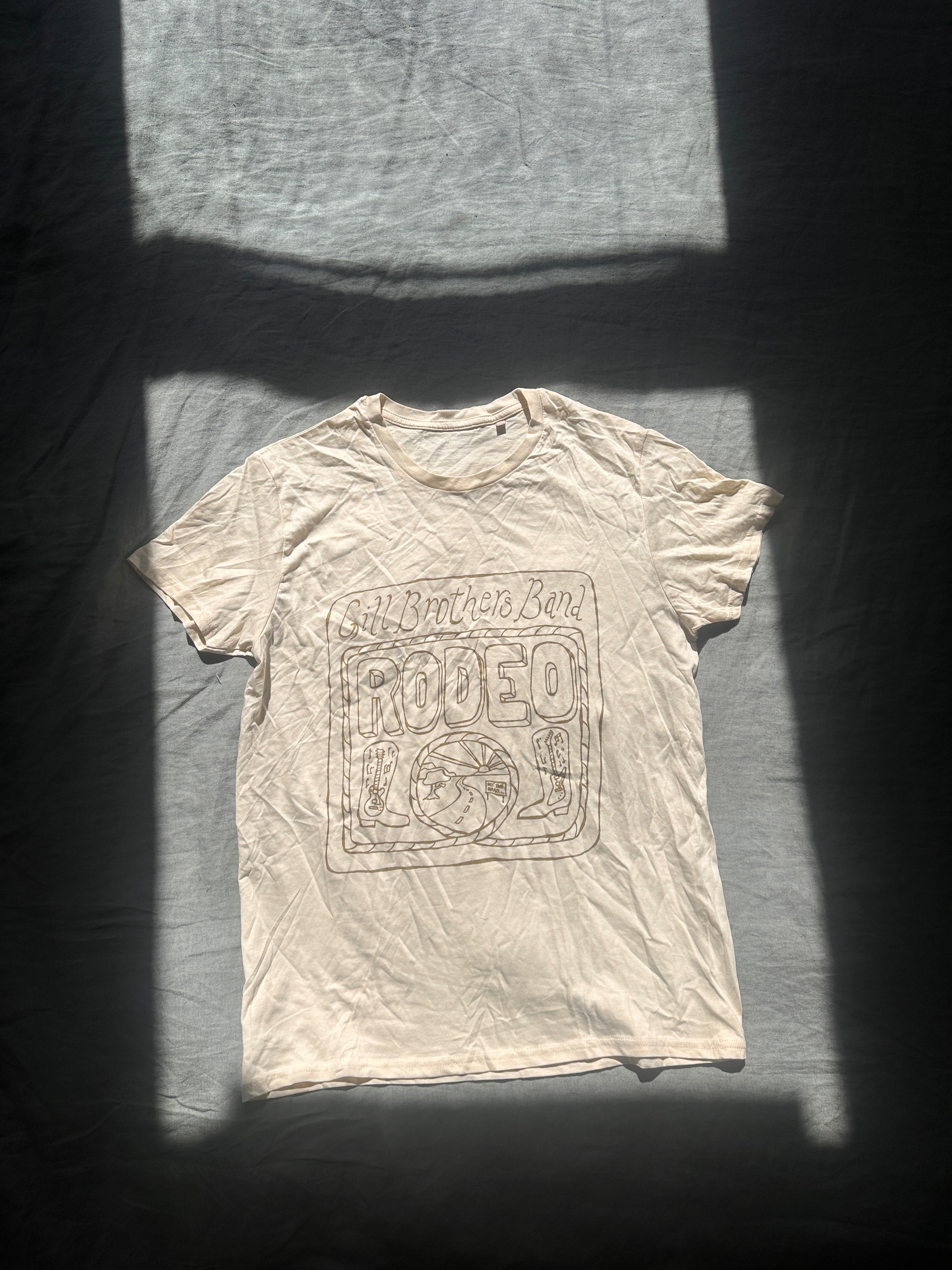 a white t - shirt with the word raped on it