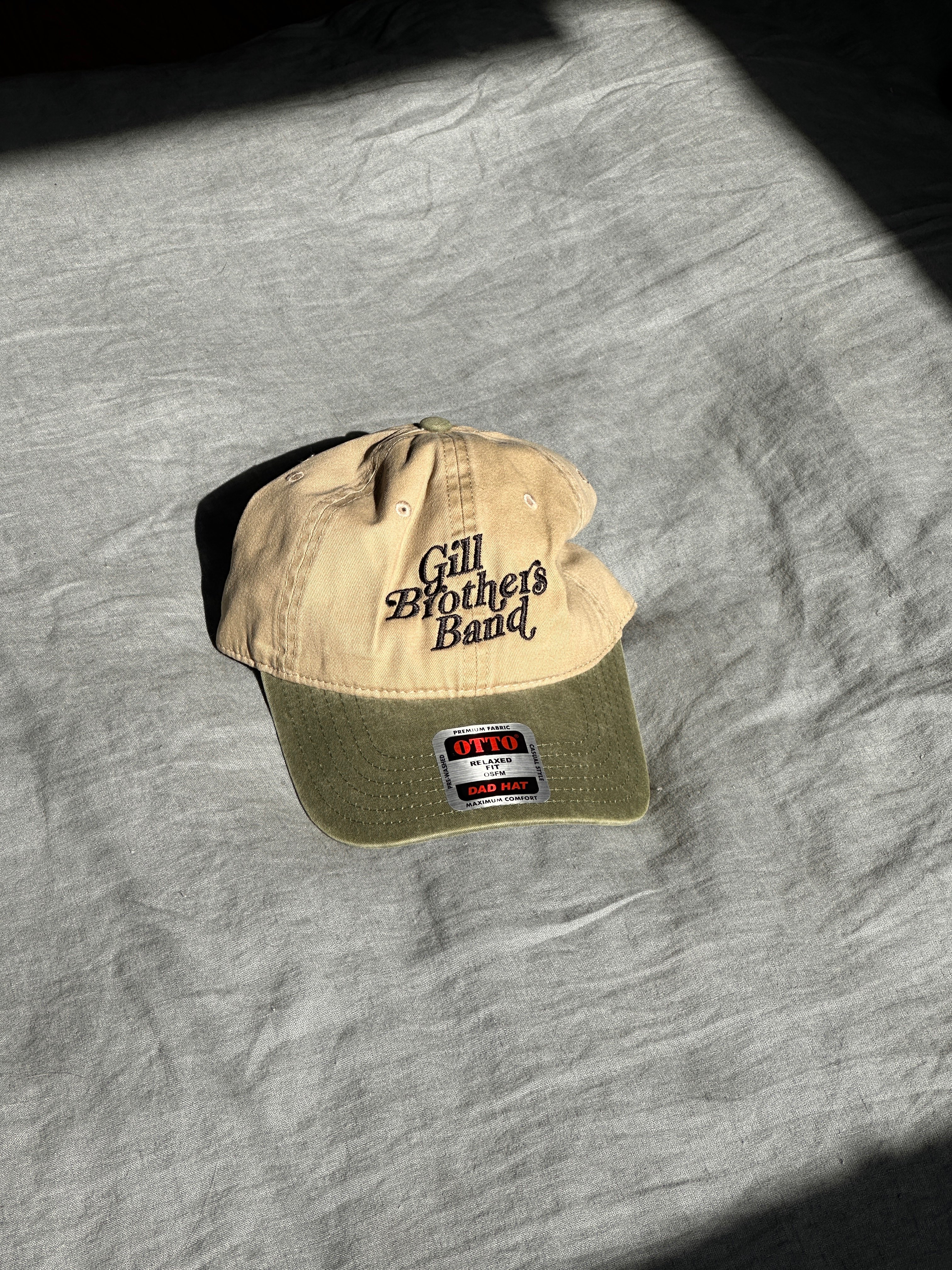 a tan hat with the words'life is good'on it