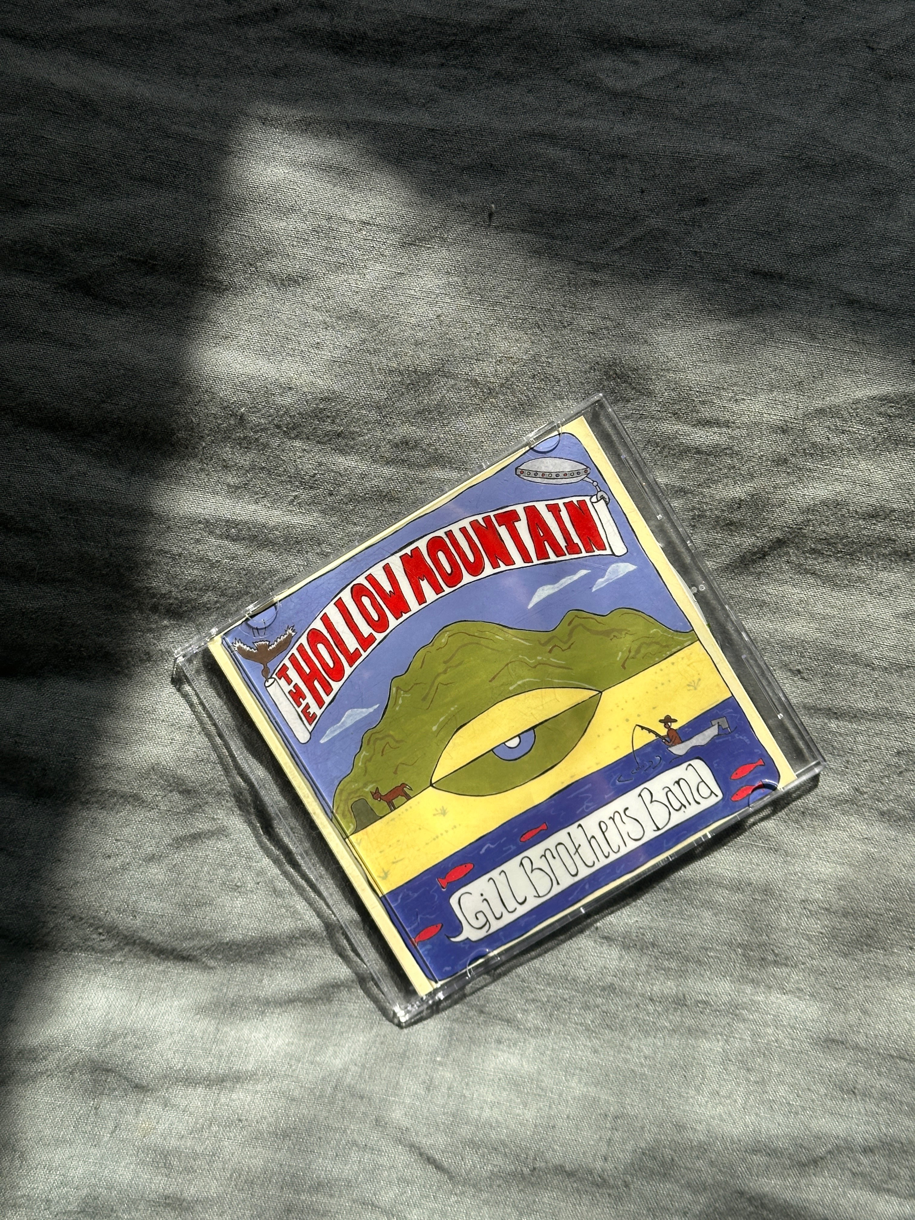 a cd with a picture of a mountain on it