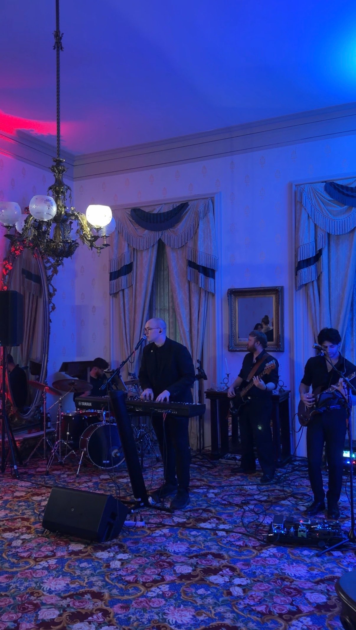 a group of people playing music in a room