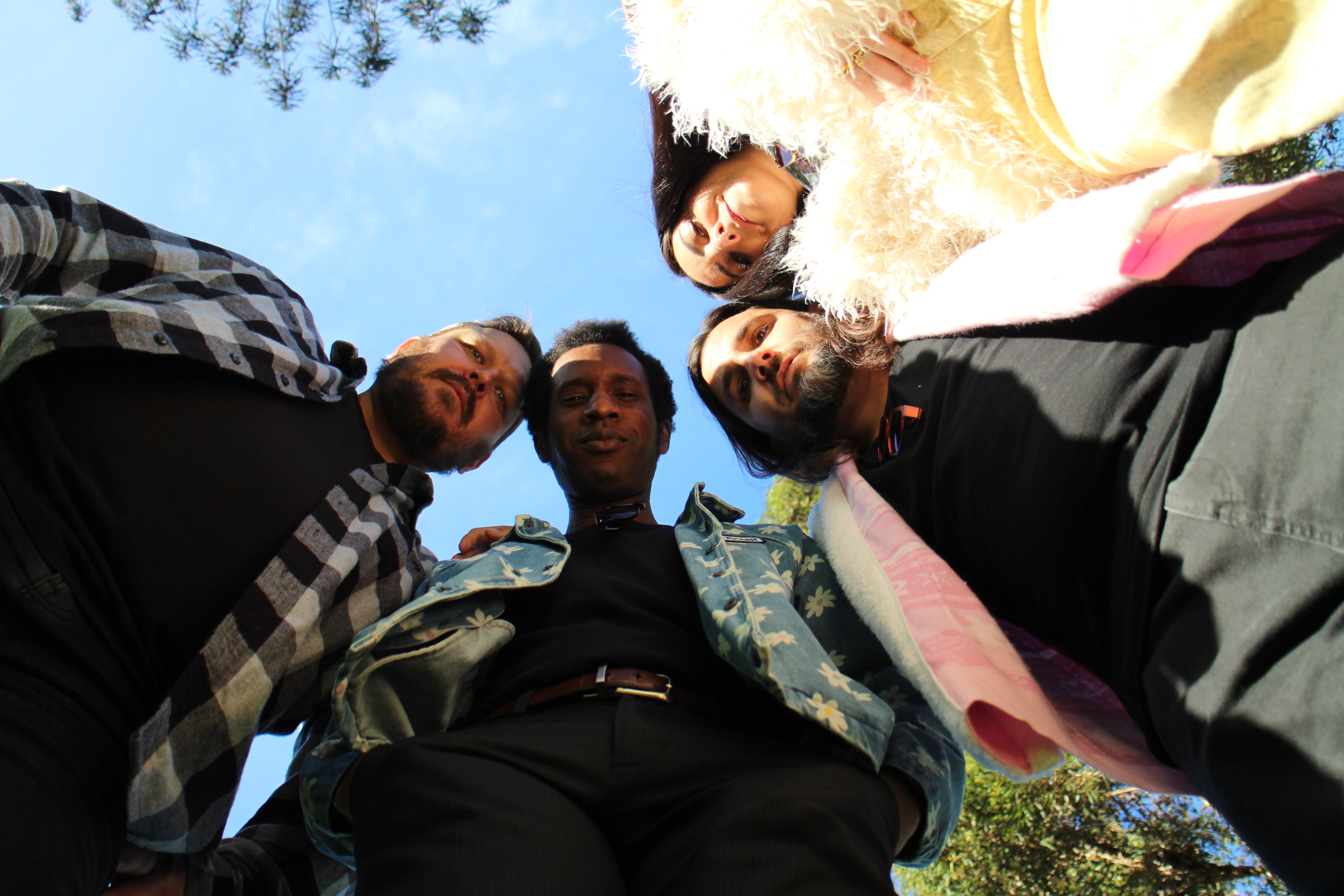 Meridian Girl - Meridian Girl EP: a group of people posing for a picture