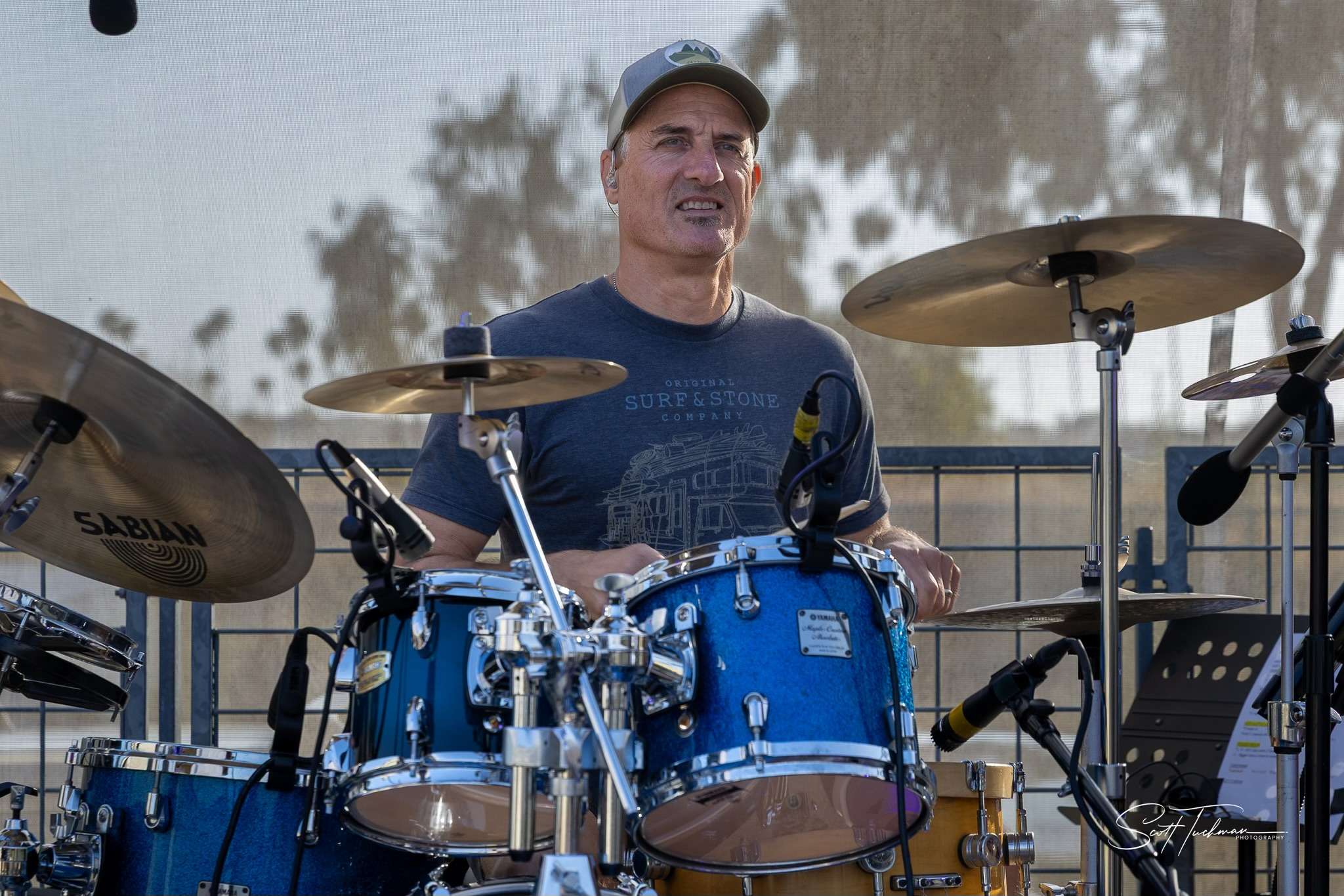 a man playing drums in front of a crowd