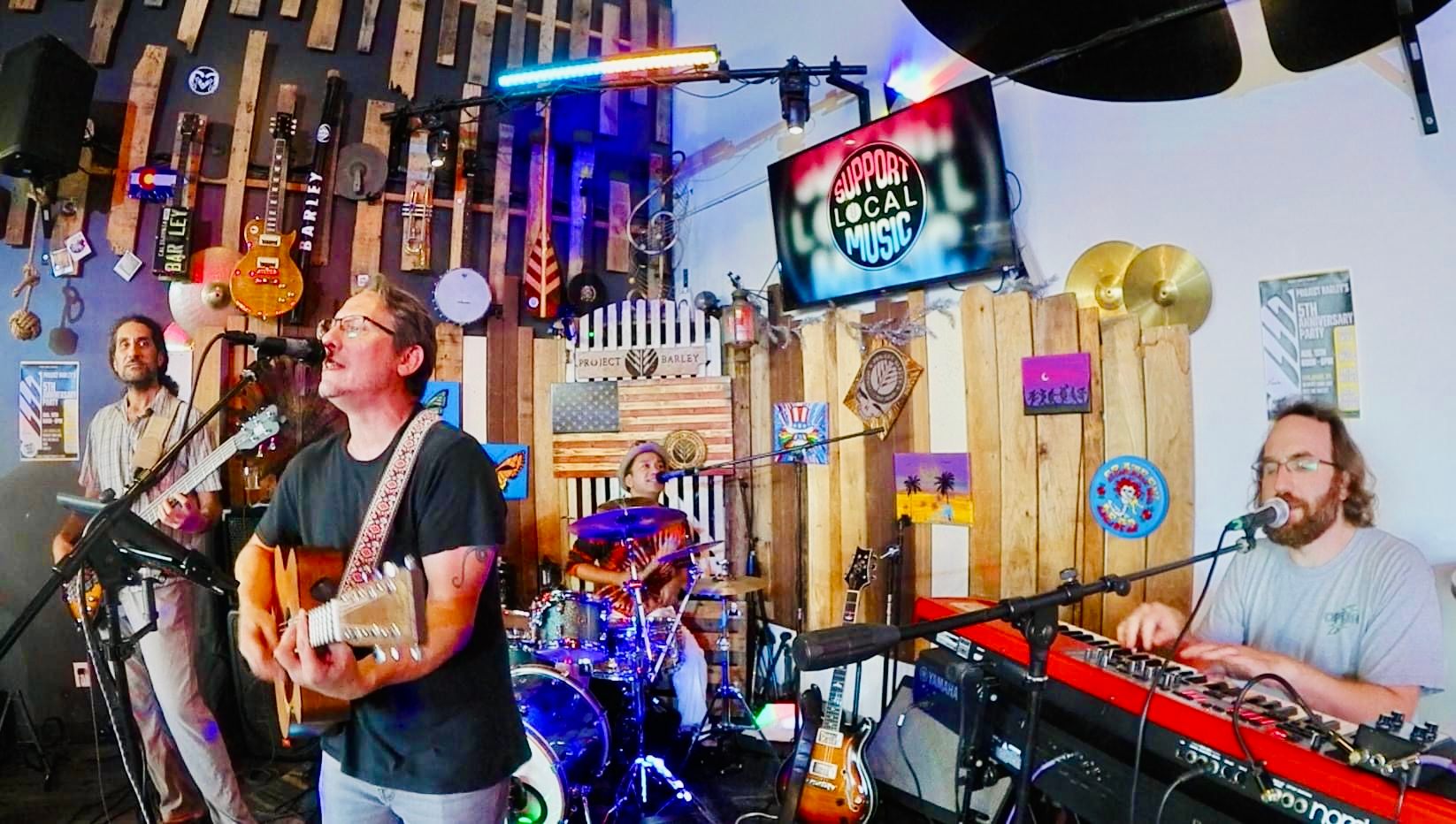 a group of people playing music in a bar