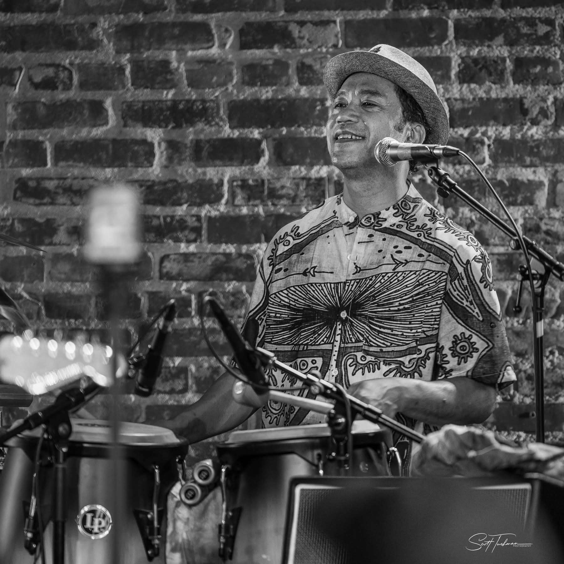 image may contain person, on stage, playing a musical instrument and indoor