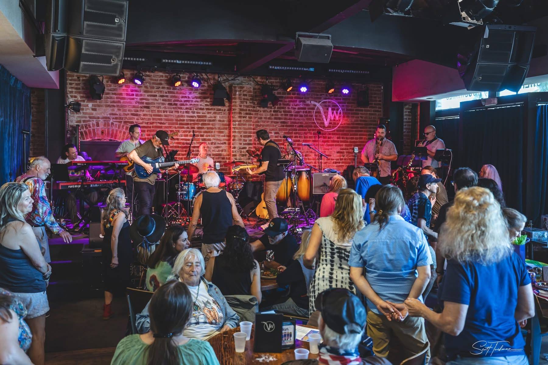a crowd of people at a music venue