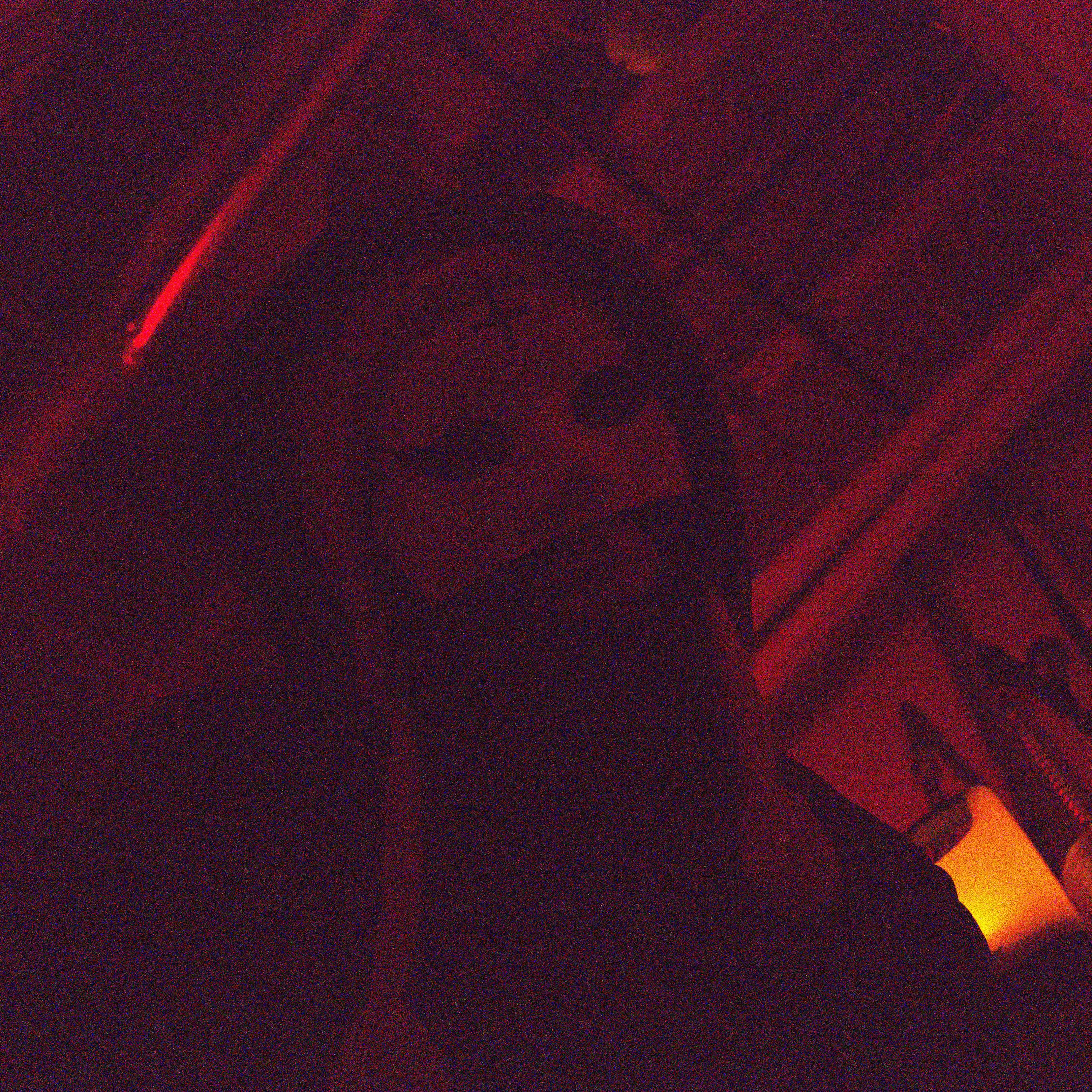 Allen Oryan - Into That Long Dark Night: a person wearing a mask in a dark room