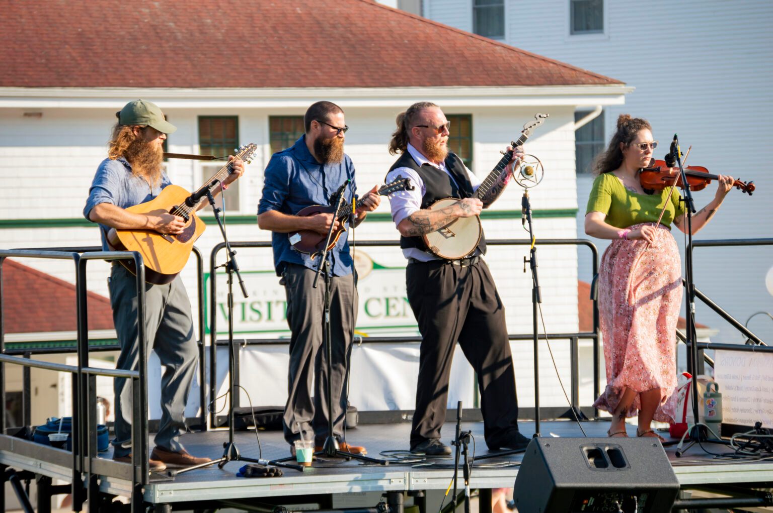 a group of people playing instruments on a stage