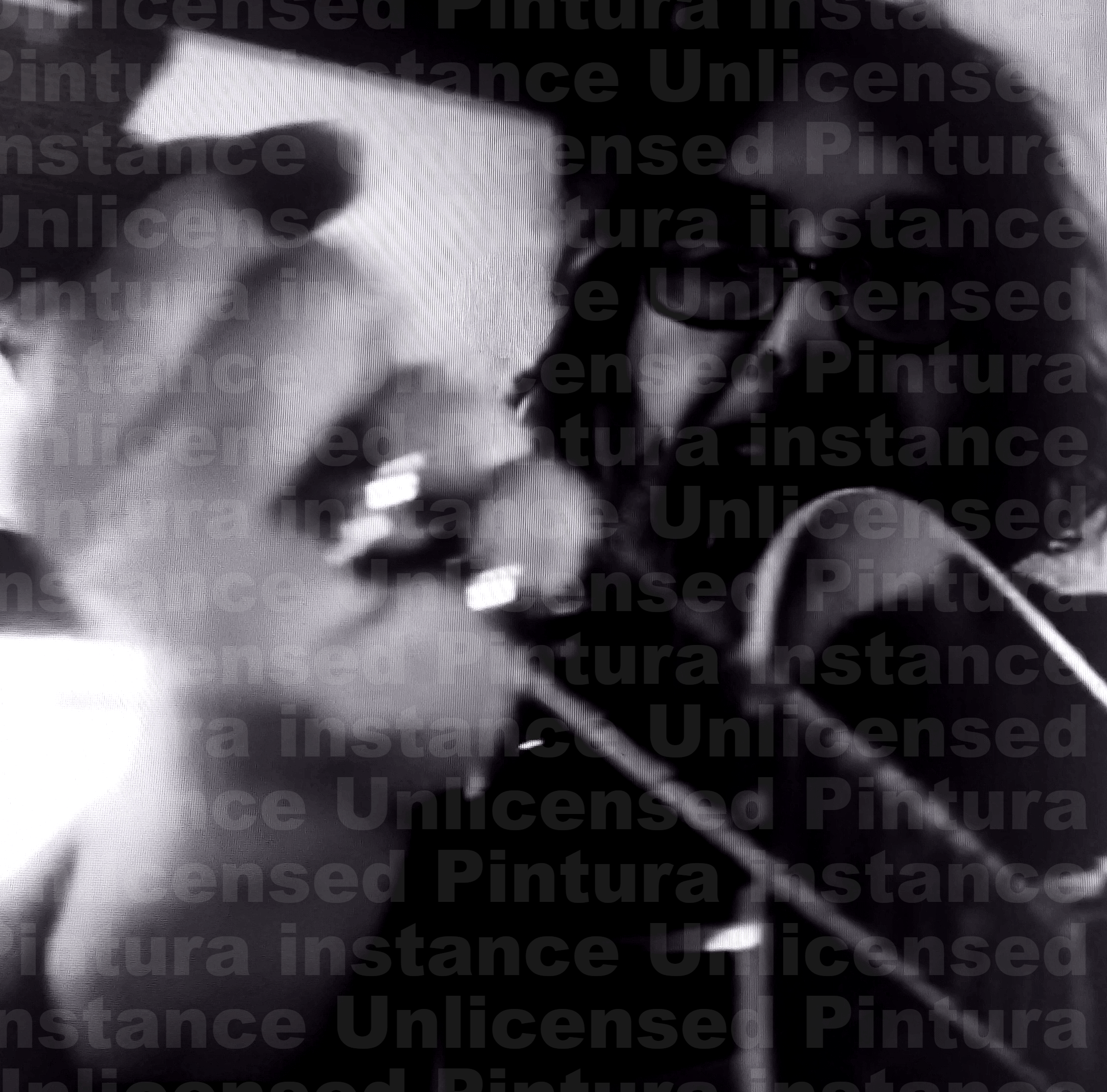 a black and white photo of a man playing a guitar