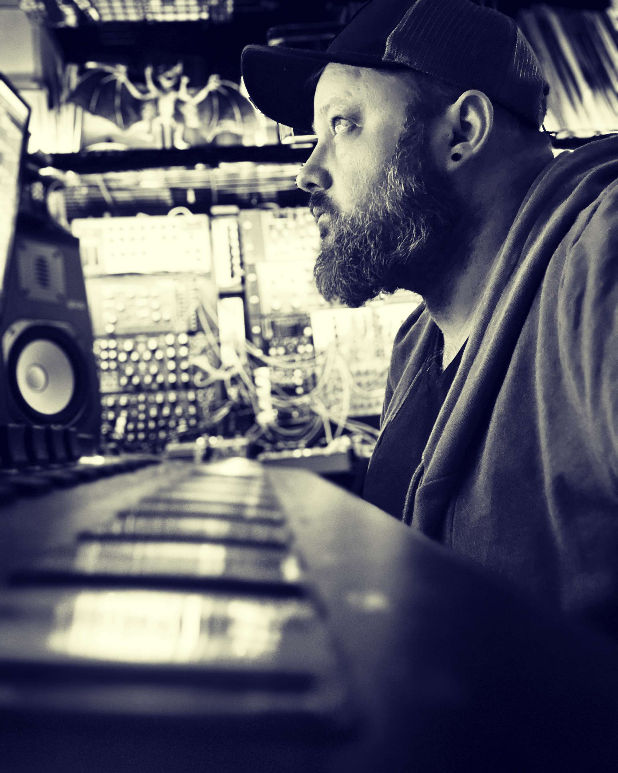 a man with a beard sitting in front of a computer