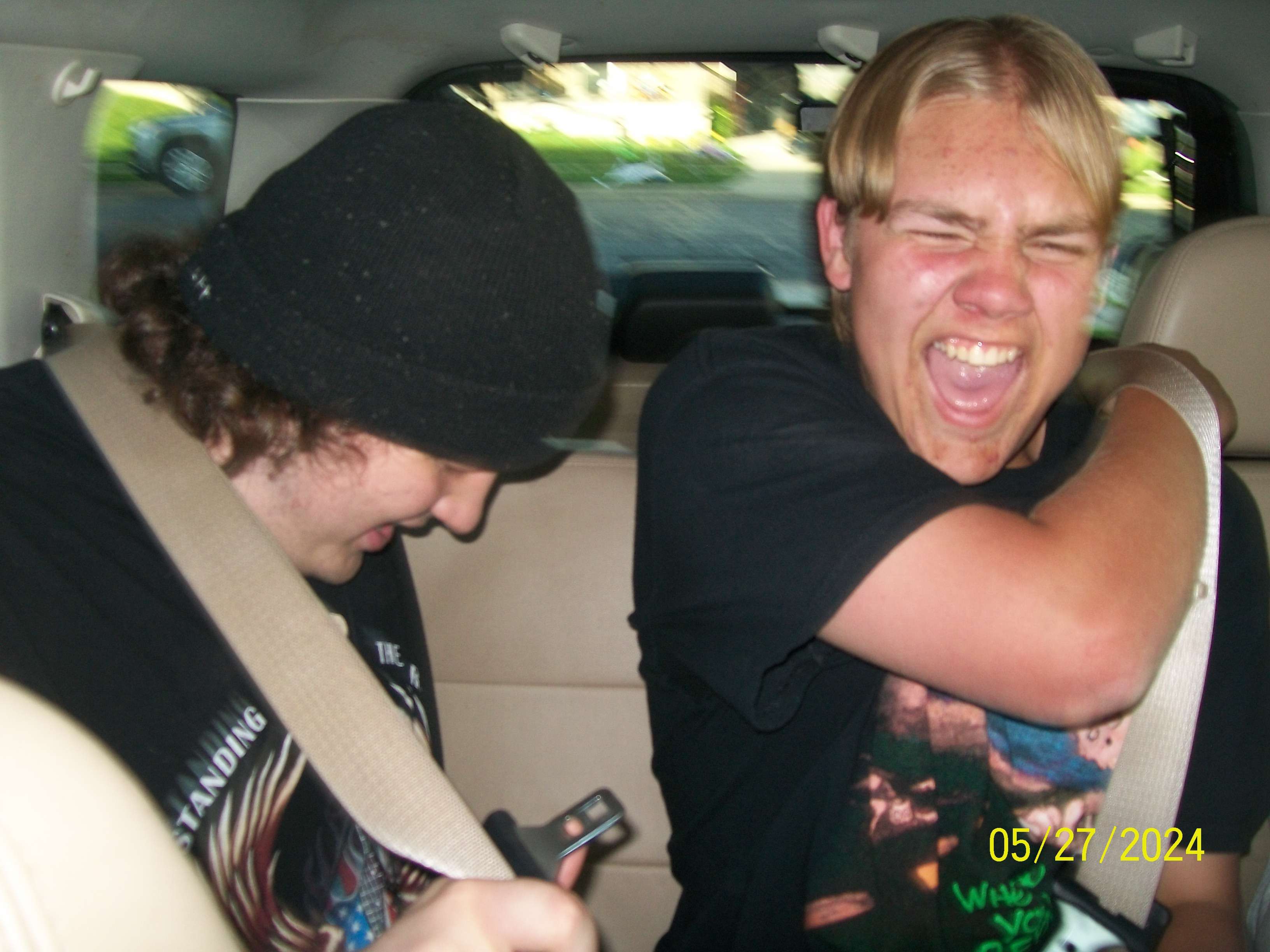 a man wearing a black t-shirt