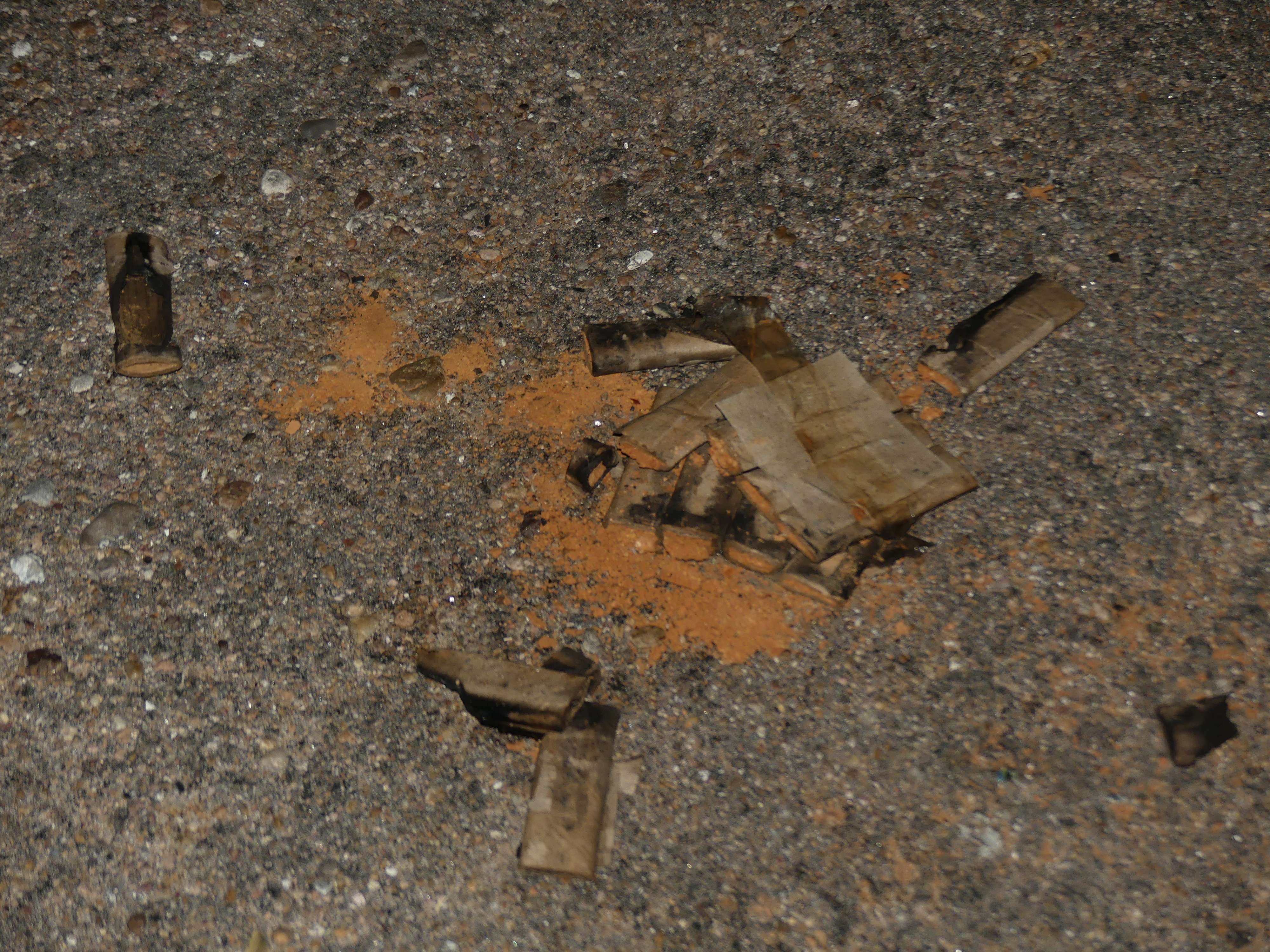 a pile of cigarette butts on the ground