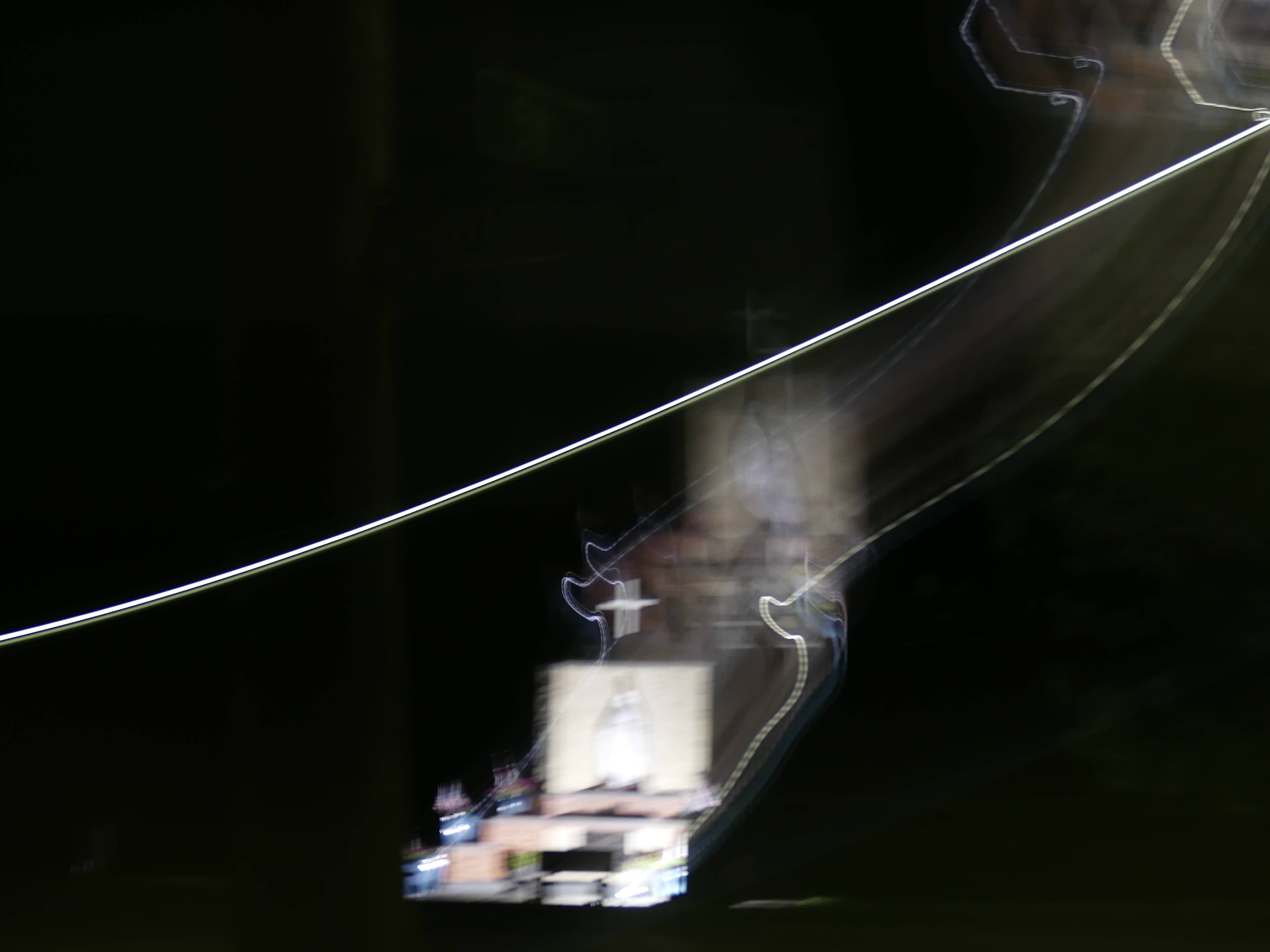 a blurry image of a train at night