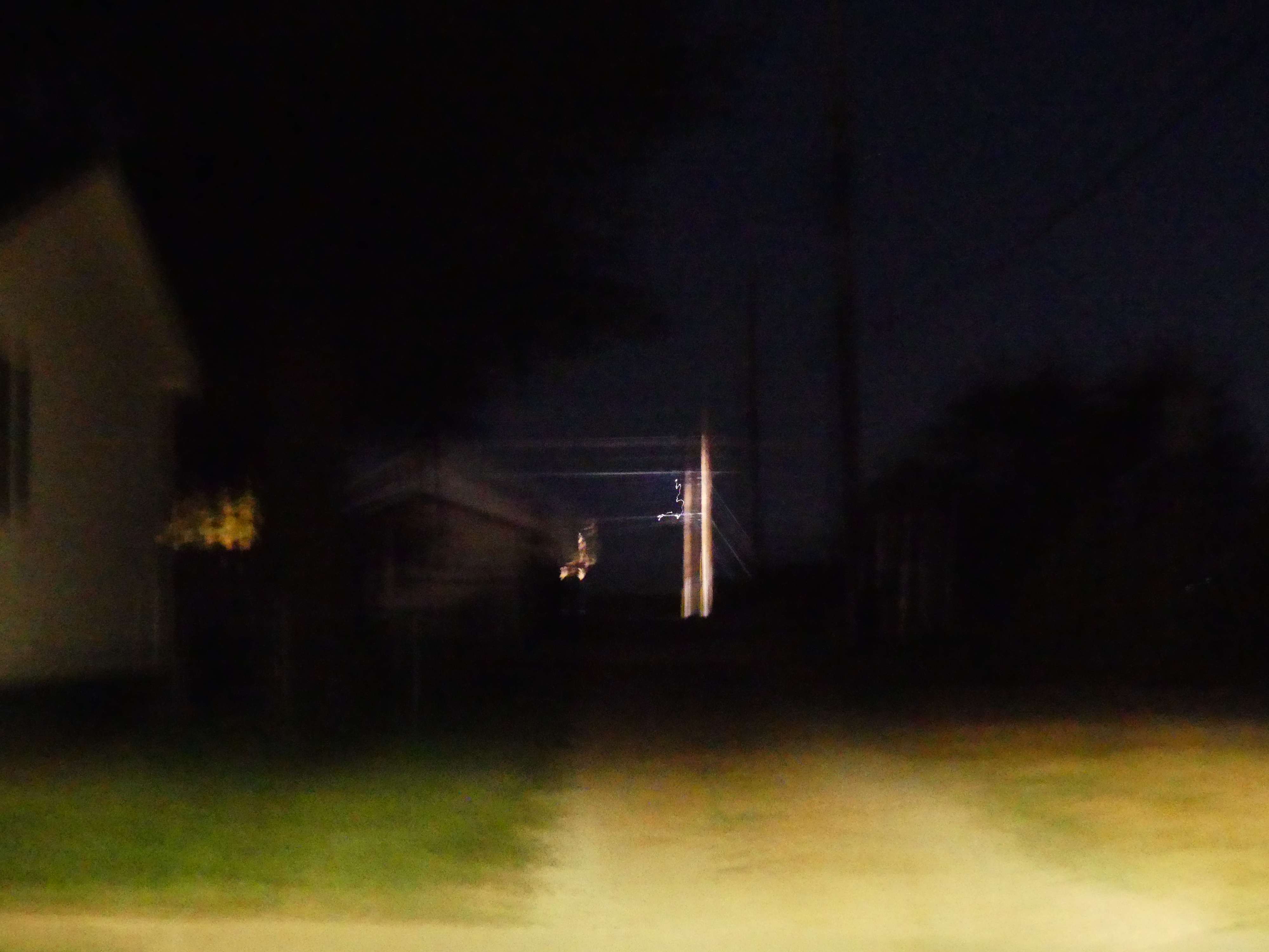 a blurry image of a street at night