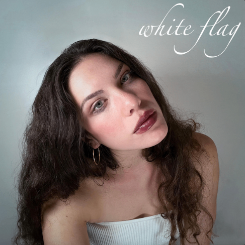 Katherine Cotter - White Flag : a woman with long curly hair is posing for a photo