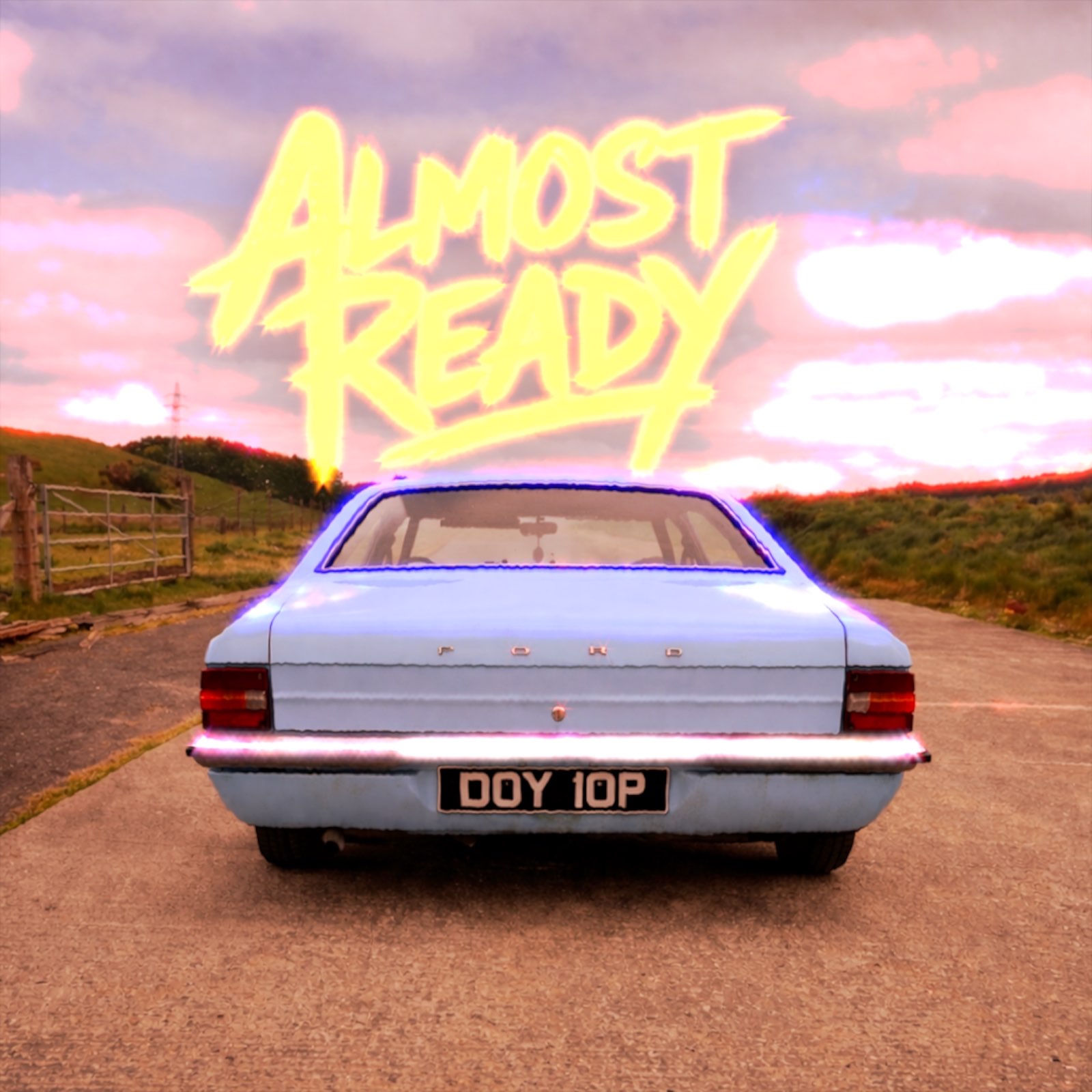  - : a blue car parked on a road with the words almost ready