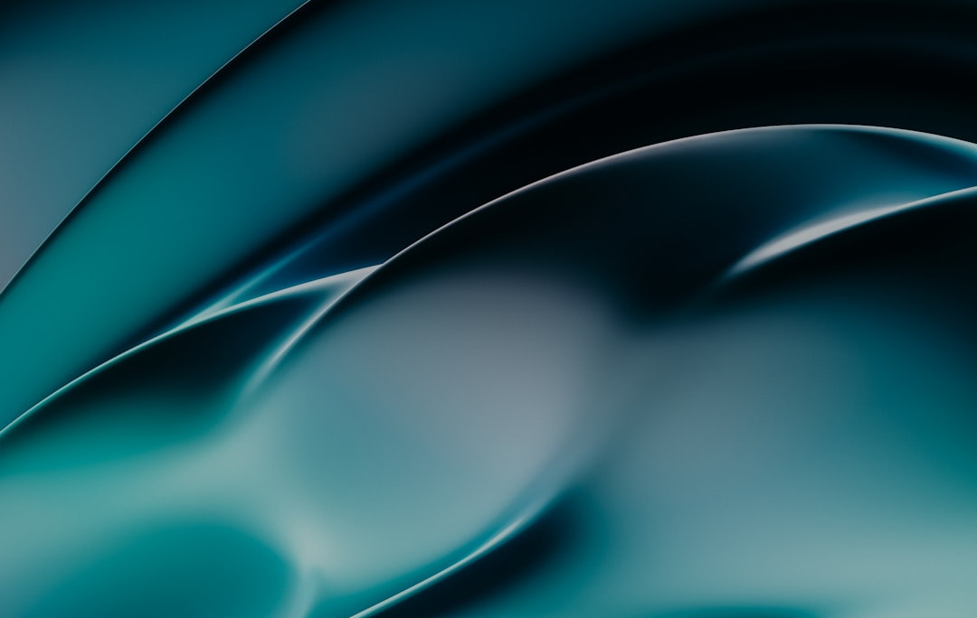 a blue and black abstract background with wavy lines