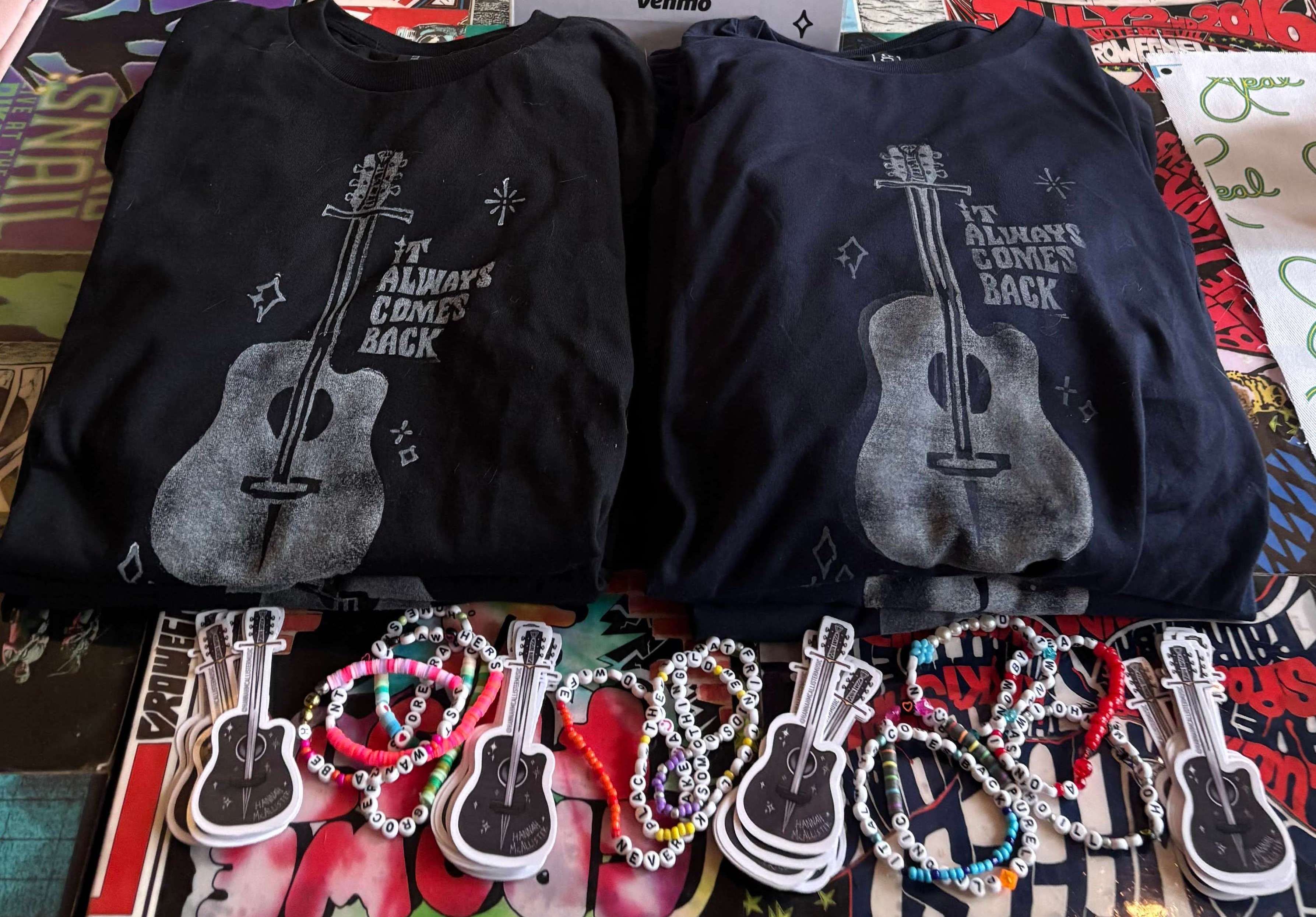 two t - shirts with a guitar on them