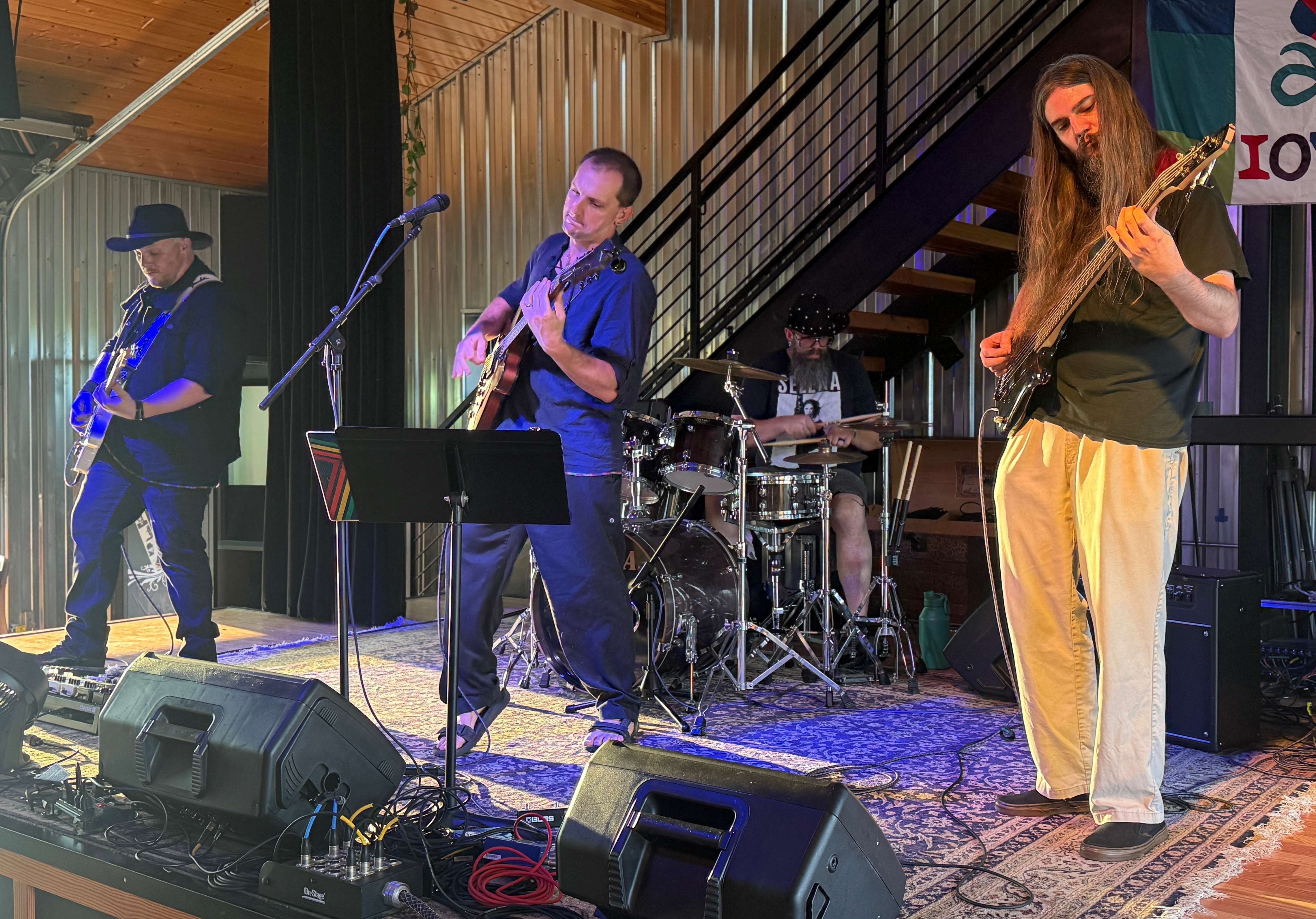 a group of people playing music on stage