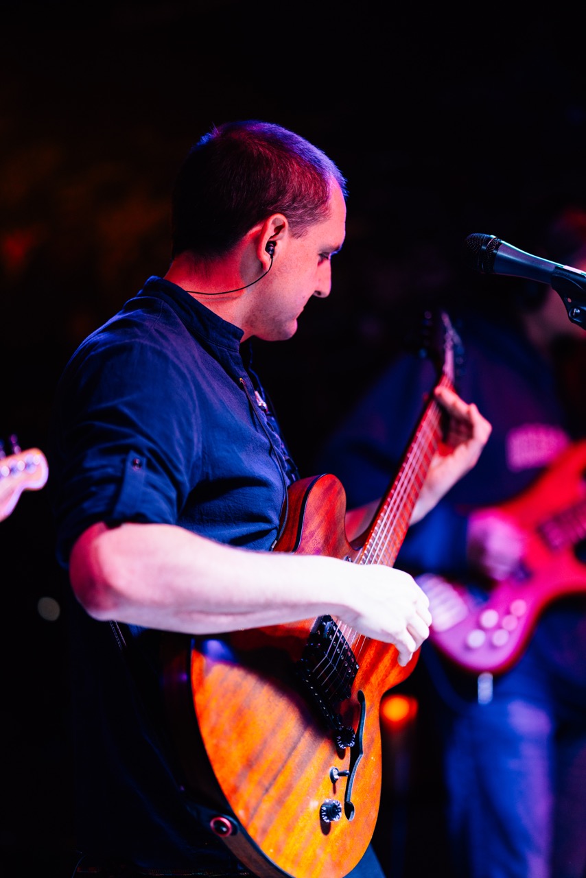 a man playing a guitar