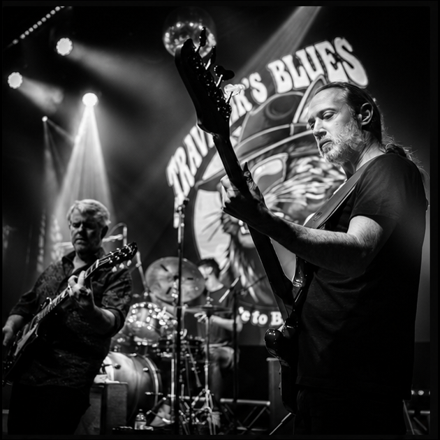 a black and white photo of a band on stage