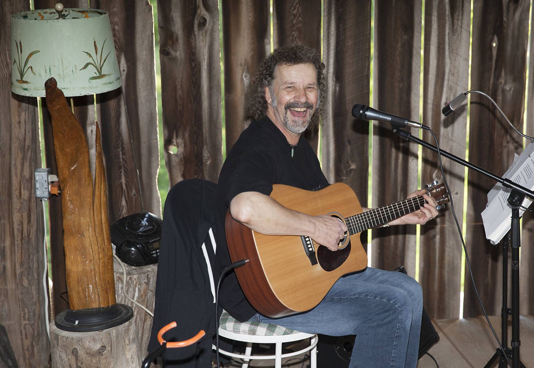 a man playing an acoustic guitar