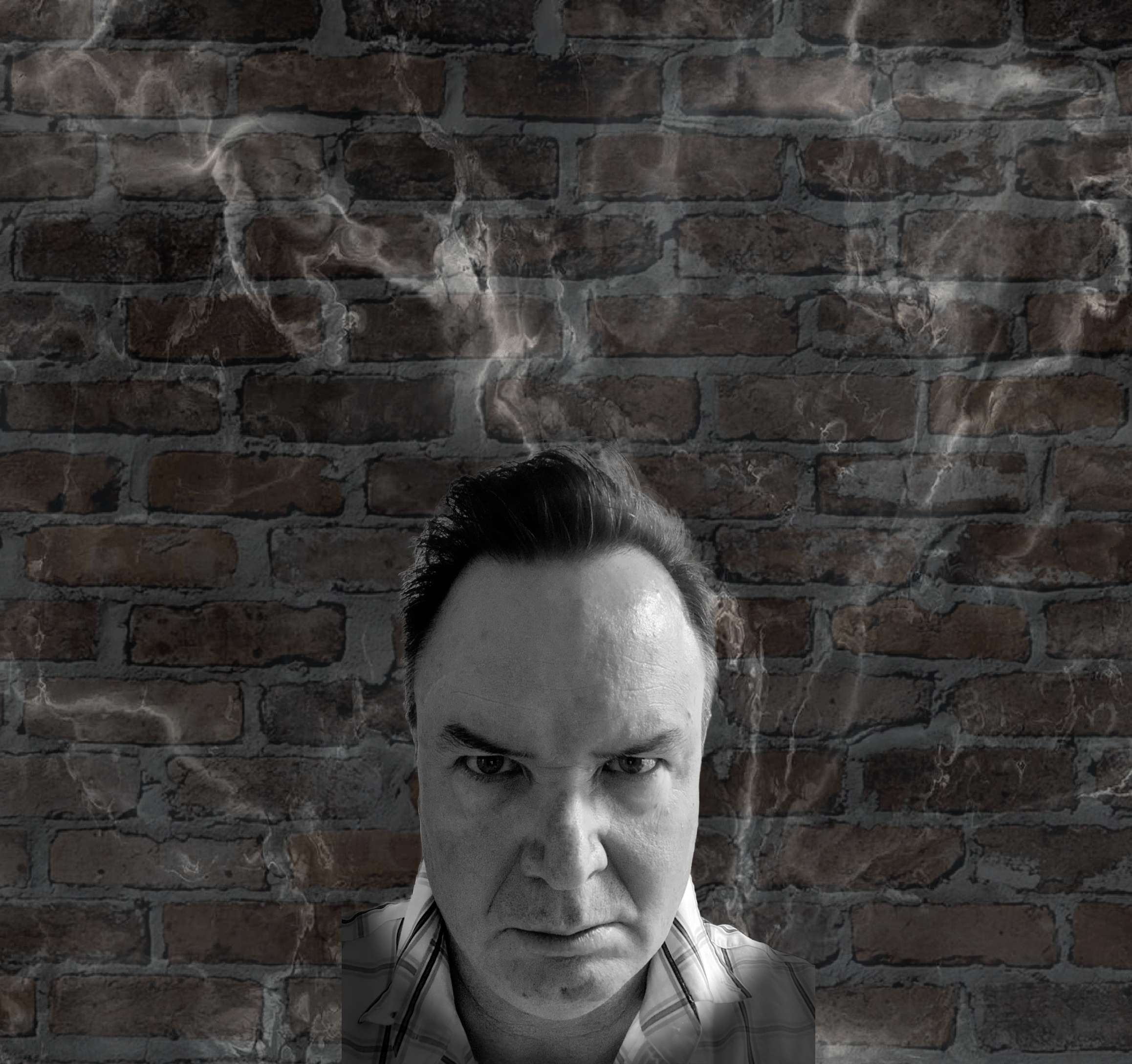 a man with smoke coming out of his head in front of a brick wall